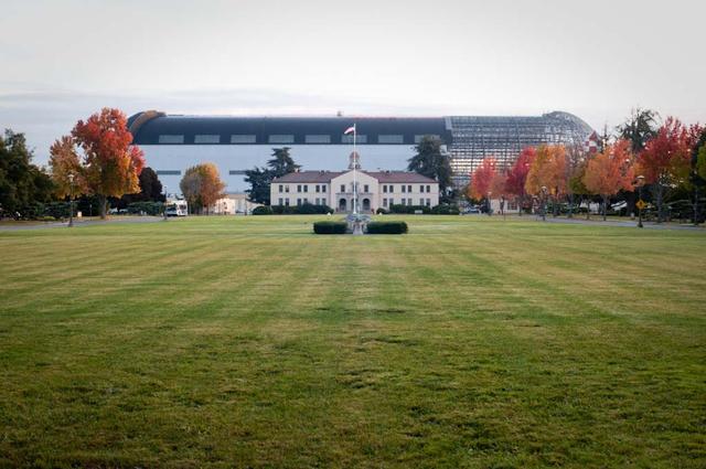 Lunar Science Institute, Bldg-17 at NASA Research Park in the fall with Hangar One deskinning project going on in backbround.
