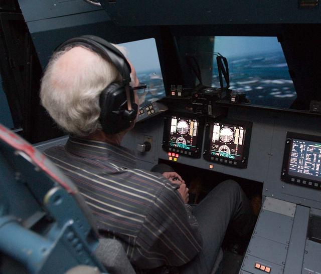 Capt. Chesley 'Sully' Sullenberger visits Ames Vertical Motion Simulator facility and takes a 'ride' in the Shuttle Cab (S-cab).