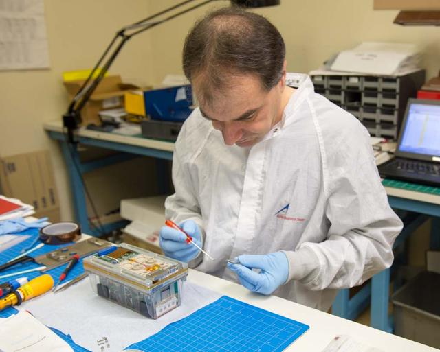 TROPI Seed Growth-1 payload (will fly to ISS on Space X 2) with Thomas Neidermaier, Europeon Modular Culitivation System Payload Intergration Manager  both from Astrium Space Transportaton, Friedrichshafen, Germany.