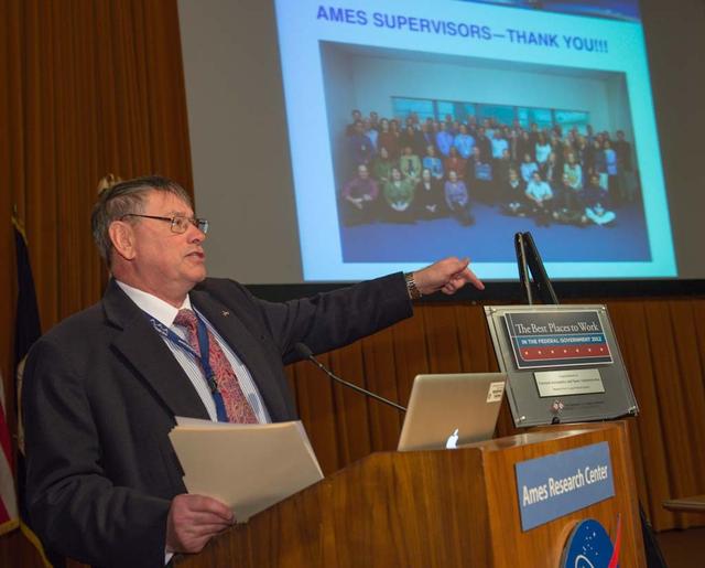Ames Center Director S. Pete Worden unveils 'Best Places to Work' plaque in Federal Government 2012 at all-hands meeting