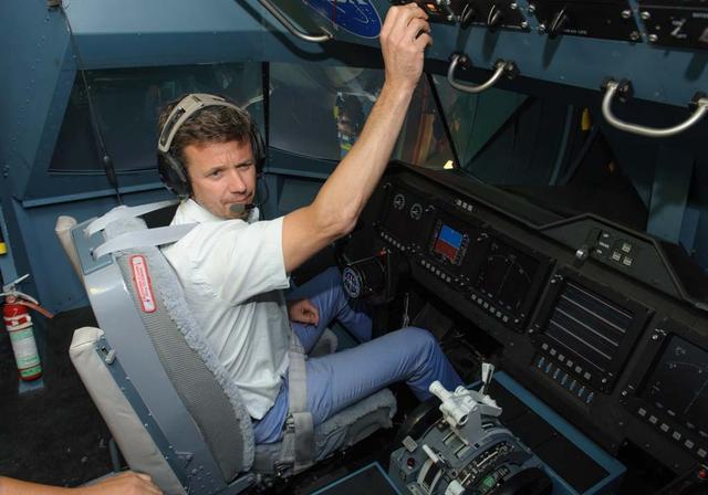 HRH Prince Frederik of Denmark visit and tour of NASA Ames Research Center. shown here at the Vertical Motion Simulator in the cockpit flying a sim.