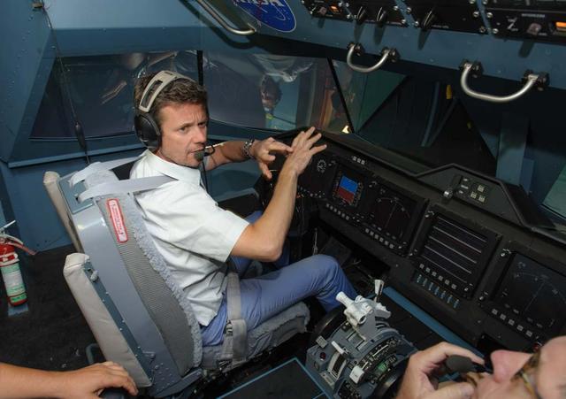 HRH Prince Frederik of Denmark visit and tour of NASA Ames Research Center. shown here at the Vertical Motion Simulator in the cockpit flying a sim.