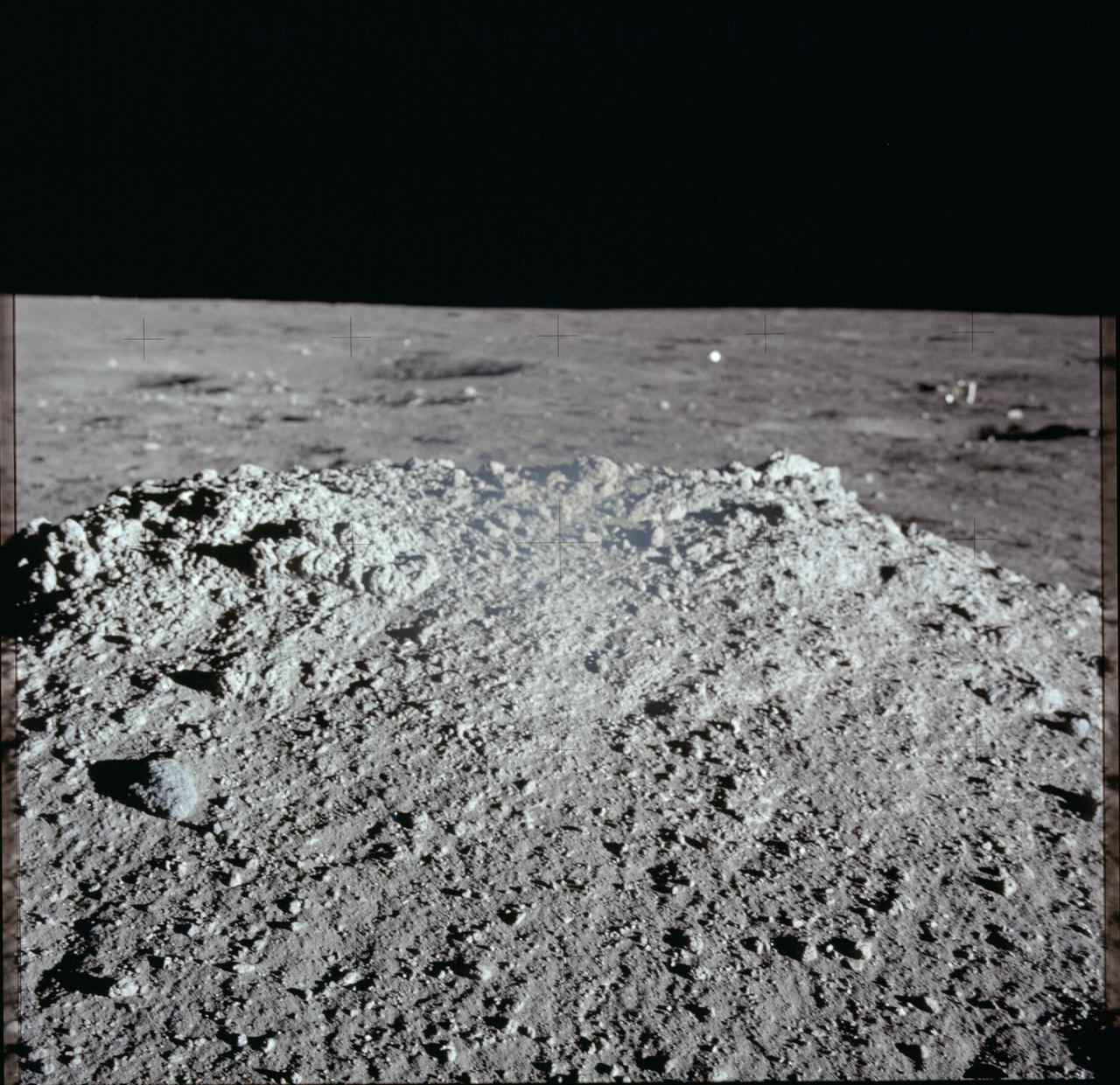 AS12-46-6832 (19 Nov. 1969) --- A close-up view of a lunar mound as photographed during the Apollo 12 extravehicular activity (EVA) on the lunar surface. Astronaut Richard F. Gordon Jr., command module pilot, remained with the Apollo 12 Command and Service Modules (CSM) in lunar orbit while astronauts Charles Conrad Jr., commander, and Alan L. Bean, lunar module pilot, descended in the Lunar Module (LM) to explore the moon.