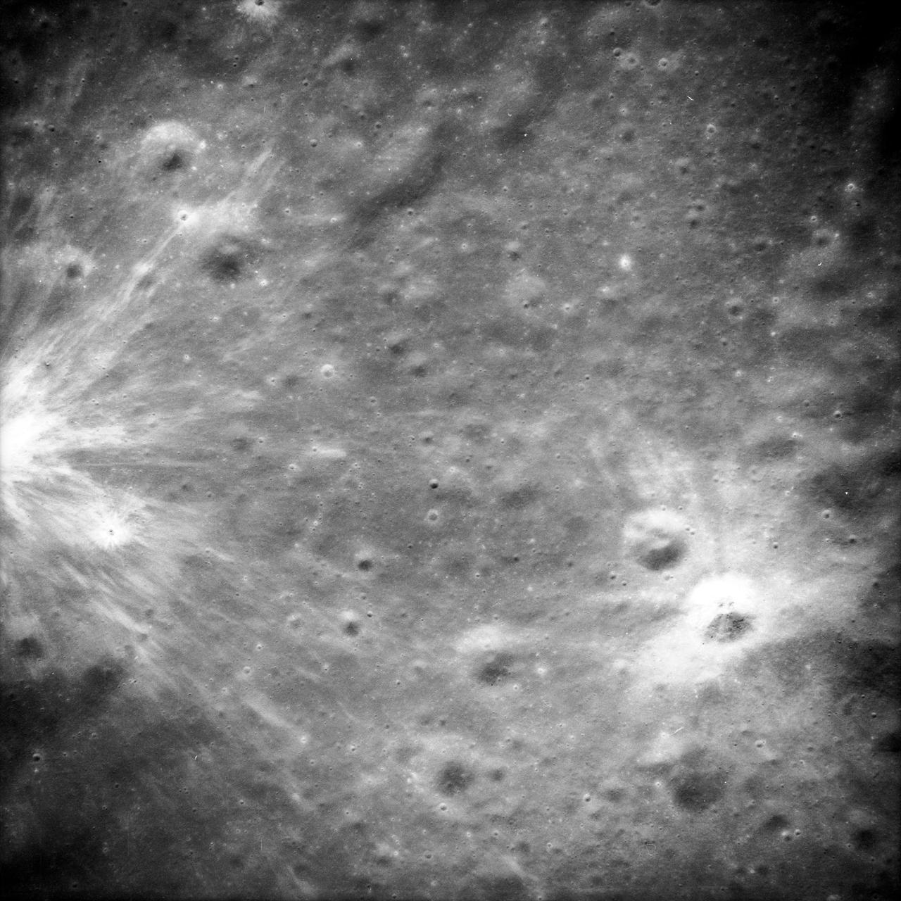 AS14-69-9523 (February 1971) --- This 500mm vertical frame taken from the Apollo 14 spacecraft is of the Apollo 16 proposed landing site "Descartes". The actual location of the target area is near the center of the picture. This photograph was taken on revolution 27 with a 56 degree sun angle. The large bright crater is approximately one kilometer in diameter and has a distinctive ray pattern which serves as an excellent landmark.