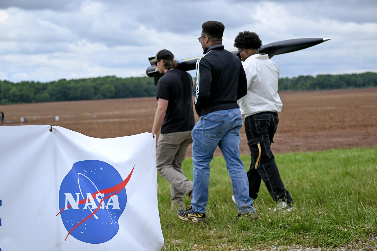 Over than 980 middle school, high school, and college students from across the nation launched more than 40 high-powered rockets just north of NASA’s Marshall Space Flight Center in Huntsville, Alabama. This year marked the 25th anniversary of the competition. To compete, students follow the NASA engineering design lifecycle by going through a series of reviews for nine months leading up to launch day.   Each year, a payload challenge is issued to the university teams, and this year’s task took inspiration from the agency’s Artemis missions, where NASA will send astronauts to explore the Moon for scientific discovery, economic benefit, and to build the foundation for the first crewed missions to Mars. Teams were challenged to include “reports” from STEMnauts, non-living objects representing astronauts. The STEMnaut “crew” had to relay real-time data to the student team’s mission control, just as the Artemis astronaut crew will do as they explore the lunar surface.    To learn more, visit: www.nasa.gov/studentlaunch.  