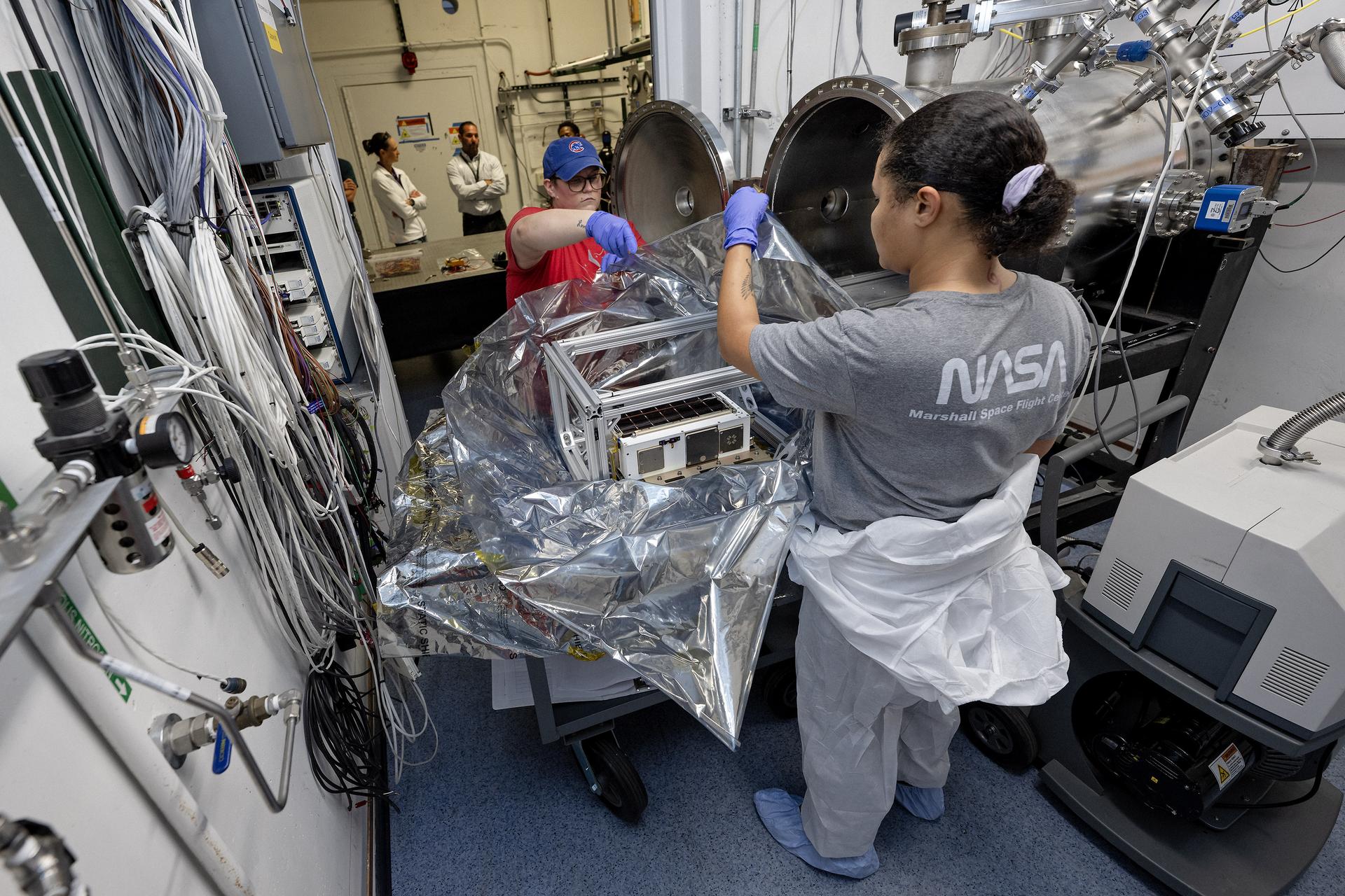 Engineers and technicians at NASA’s Marshall Space Flight Center in Huntsville, Alabama, are putting the Green Propulsion Dual Mode flight hardware through critical pre-launch testing. The mission, a 6-U CubeSat, will demonstrate a first-of-its-kind integrated propulsion system that uses a single, non-toxic "green" propellant called ASCENT to perform both high-thrust and low-thrust maneuvers in space. These behind-the-scenes photos capture the team conducting rigorous physical and environmental tests inside the center’s Small Spacecraft Servicing and Integration Lab to ensure the spacecraft is ready for the extreme environment of low Earth orbit.