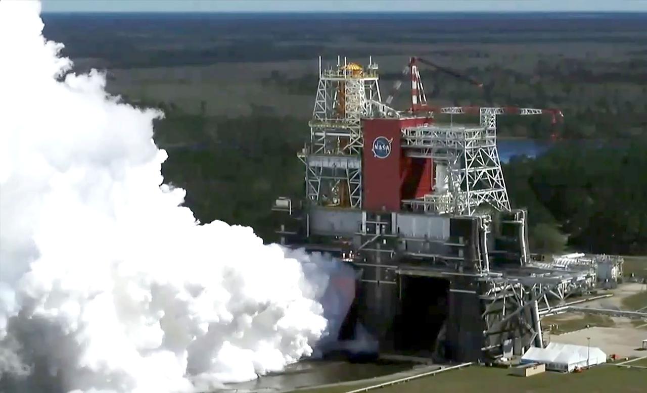 A drone camera offers a bird’s-eye view as NASA conducts a hot fire test March 18, 2021, of the core stage for the agency’s Space Launch System rocket on the B-2 Test Stand at Stennis Space Center near Bay St. Louis, Mississippi. The hot fire test of the stage’s four RS-25 engines generated a combined 1.6 million pounds of thrust, just as will occur during an actual launch. The hot fire is the final test of the Green Run test series, which represents a comprehensive assessment of the core stage and its integrated systems prior to its launch on the Artemis I mission to the Moon.