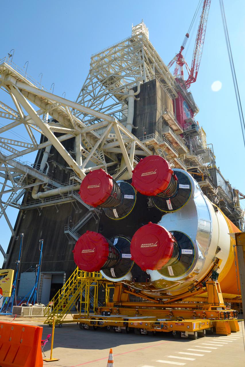 Team members at NASA’s Stennis Space Center near Bay St. Louis, Mississippi, load the first core stage of the agency’s Space Launch System (SLS) rocket on to the agency’s Pegasus barge in preparation for its transport to Kennedy Space Center in Florida. The loading activity followed removal of the stage from the B-2 Test Stand at Stennis on April 19-20, 2021. It comes about a month after NASA conducted a successful hot fire of the stage and its four RS-25 engines on March 18 and after teams completed various refurbishment activities. Once at Kennedy, the will be integrated with the rest of SLS rocket and prepared for the launch of the Artemis I mission to the Moon. Photo Credit: NASA