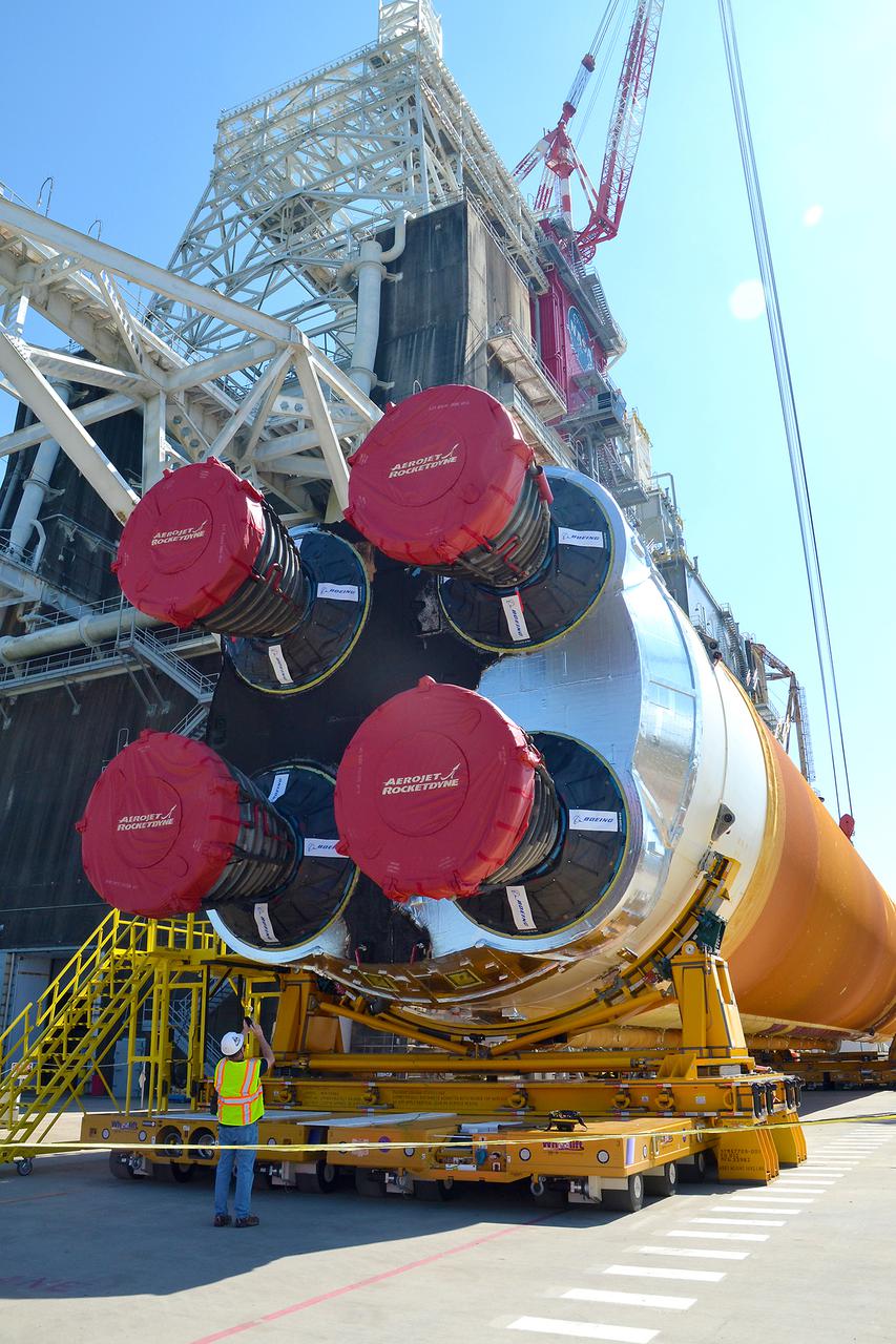 Team members at NASA’s Stennis Space Center near Bay St. Louis, Mississippi, load the first core stage of the agency’s Space Launch System (SLS) rocket on to the agency’s Pegasus barge in preparation for its transport to Kennedy Space Center in Florida. The loading activity followed removal of the stage from the B-2 Test Stand at Stennis on April 19-20, 2021. It comes about a month after NASA conducted a successful hot fire of the stage and its four RS-25 engines on March 18 and after teams completed various refurbishment activities. Once at Kennedy, the will be integrated with the rest of SLS rocket and prepared for the launch of the Artemis I mission to the Moon. Photo Credit: NASA