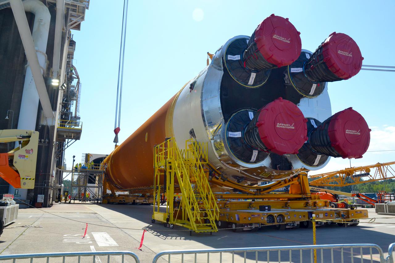 Team members at NASA’s Stennis Space Center near Bay St. Louis, Mississippi, load the first core stage of the agency’s Space Launch System (SLS) rocket on to the agency’s Pegasus barge in preparation for its transport to Kennedy Space Center in Florida. The loading activity followed removal of the stage from the B-2 Test Stand at Stennis on April 19-20, 2021. It comes about a month after NASA conducted a successful hot fire of the stage and its four RS-25 engines on March 18 and after teams completed various refurbishment activities. Once at Kennedy, the will be integrated with the rest of SLS rocket and prepared for the launch of the Artemis I mission to the Moon. Photo Credit: NASA