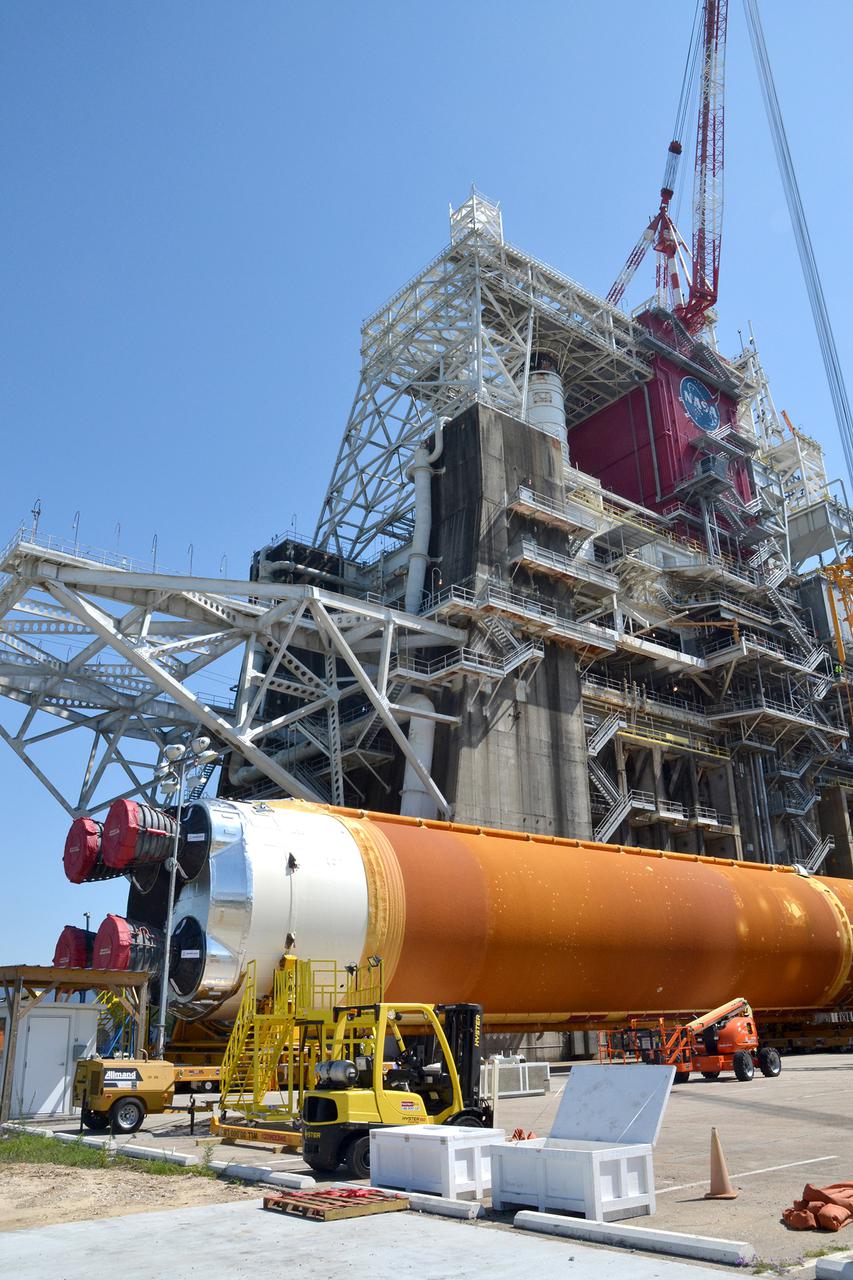 Team members at NASA’s Stennis Space Center near Bay St. Louis, Mississippi, load the first core stage of the agency’s Space Launch System (SLS) rocket on to the agency’s Pegasus barge in preparation for its transport to Kennedy Space Center in Florida. The loading activity followed removal of the stage from the B-2 Test Stand at Stennis on April 19-20, 2021. It comes about a month after NASA conducted a successful hot fire of the stage and its four RS-25 engines on March 18 and after teams completed various refurbishment activities. Once at Kennedy, the will be integrated with the rest of SLS rocket and prepared for the launch of the Artemis I mission to the Moon. Photo Credit: NASA