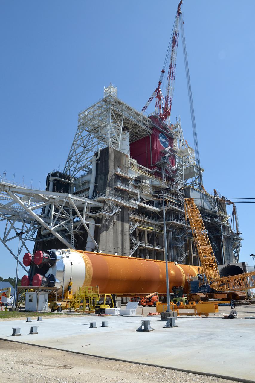Team members at NASA’s Stennis Space Center near Bay St. Louis, Mississippi, load the first core stage of the agency’s Space Launch System (SLS) rocket on to the agency’s Pegasus barge in preparation for its transport to Kennedy Space Center in Florida. The loading activity followed removal of the stage from the B-2 Test Stand at Stennis on April 19-20, 2021. It comes about a month after NASA conducted a successful hot fire of the stage and its four RS-25 engines on March 18 and after teams completed various refurbishment activities. Once at Kennedy, the will be integrated with the rest of SLS rocket and prepared for the launch of the Artemis I mission to the Moon. Photo Credit: NASA