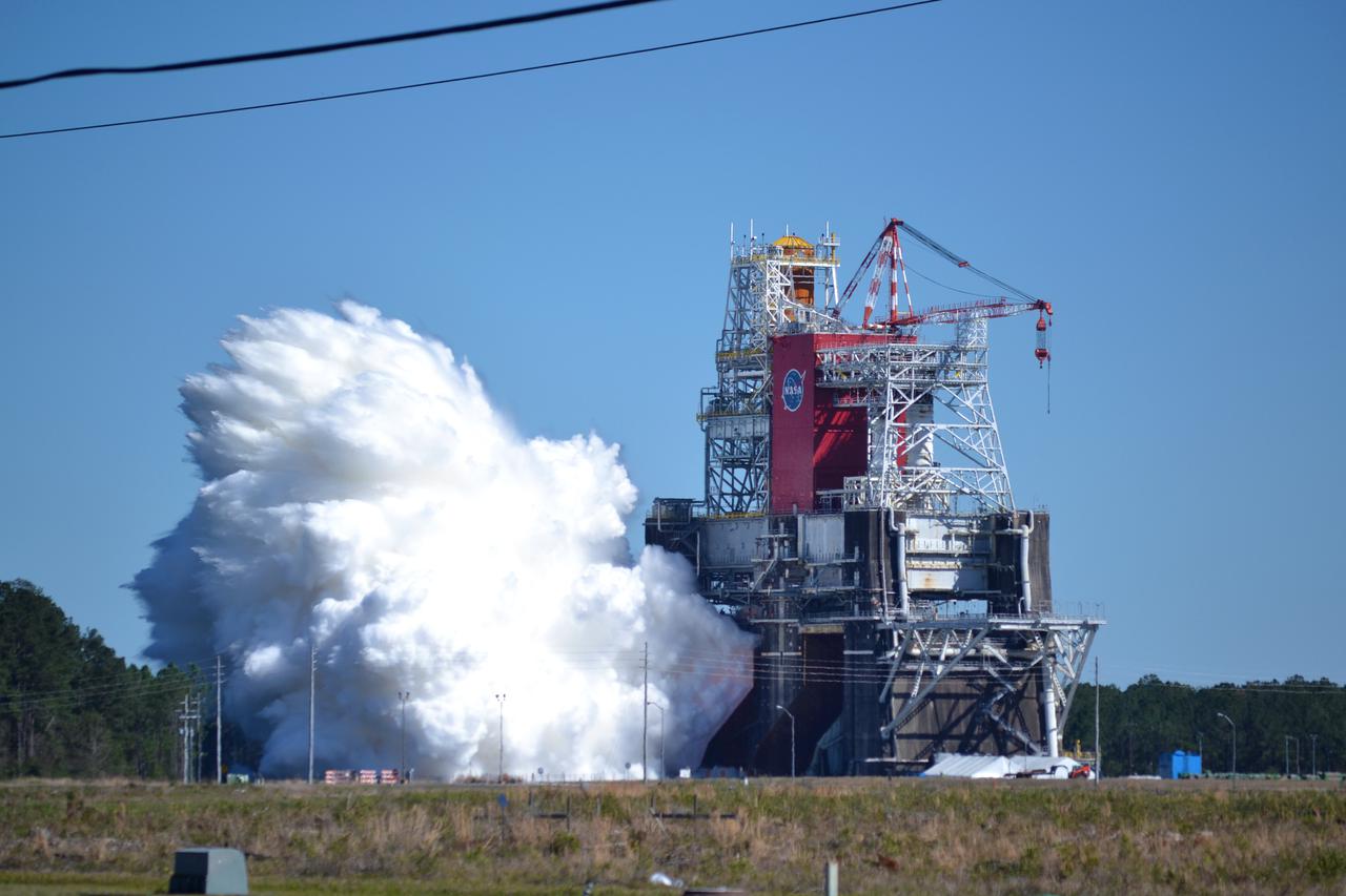 NASA conducts a hot fire test March 18, 2021, of the core stage for the agency’s Space Launch System rocket on the B-2 Test Stand at Stennis Space Center near Bay St. Louis, Mississippi. The hot fire test of the stage’s four RS-25 engines generated a combined 1.6 million pounds of thrust, just as will occur during an actual launch. The hot fire is the final test of the Green Run test series, which represents a comprehensive assessment of the core stage and its integrated systems prior to its launch on the Artemis I mission to the Moon.