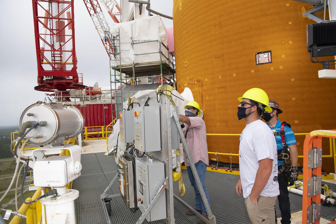 Team members at NASA’s Stennis Space Center near Bay St. Louis, Mississippi, complete refurbishment work on the first core stage of the agency’s Space Launch System (SLS) rocket. The work followed a successful hot fire of the stage and its four RS-25 engines March 18. The hot fire marked the culmination of a yearlong Green Run series of tests of the stage and its integrated systems. Following refurbishment work, the core stage will be removed from the test stand and transported to Kennedy Space Center in Florida, aboard NASA’s Pegasus barge, shown delivering equipment to the B-2 Test Stand. At Kennedy, the core stage will be integrated with the rest of SLS rocket and prepared for the launch of the Artemis I mission to the Moon.  Photo Credit: NASA