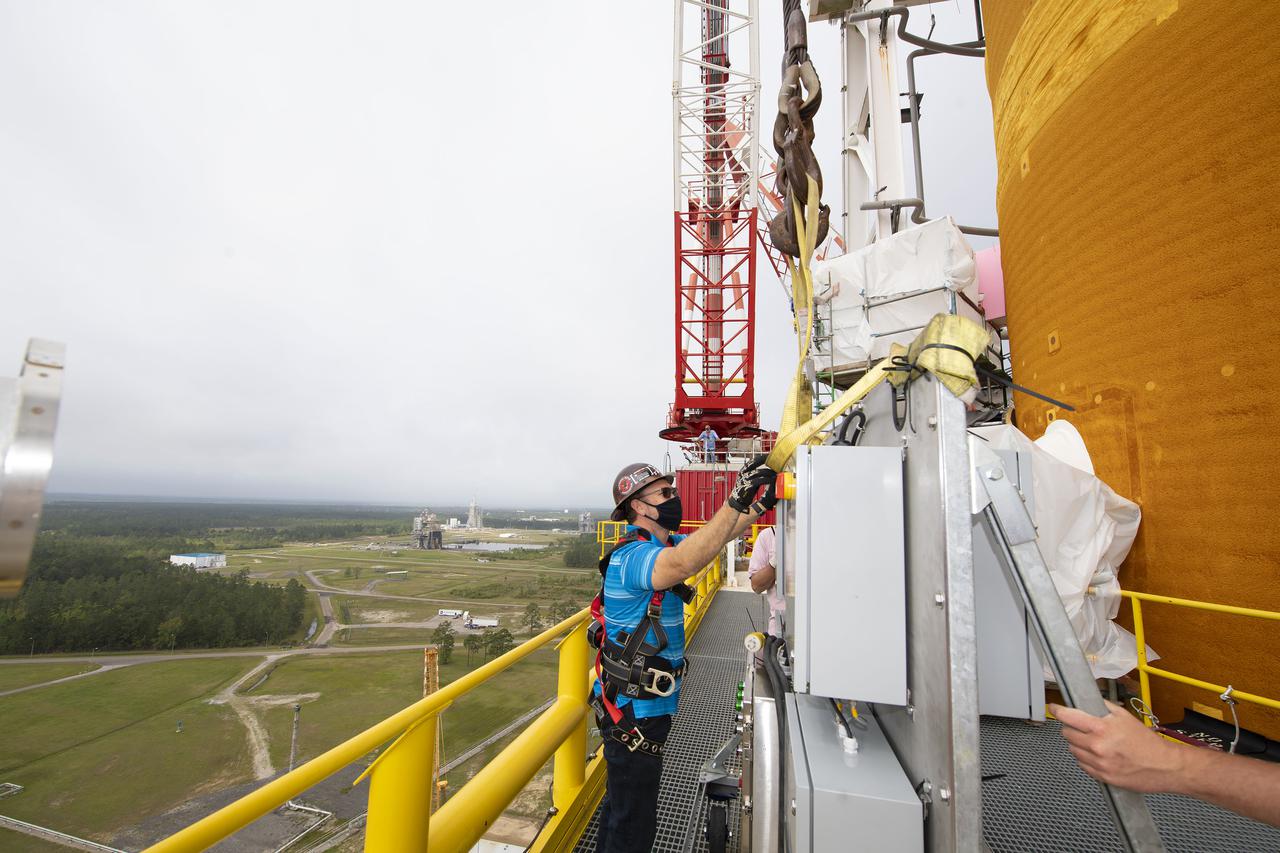 Team members at NASA’s Stennis Space Center near Bay St. Louis, Mississippi, complete refurbishment work on the first core stage of the agency’s Space Launch System (SLS) rocket. The work followed a successful hot fire of the stage and its four RS-25 engines March 18. The hot fire marked the culmination of a yearlong Green Run series of tests of the stage and its integrated systems. Following refurbishment work, the core stage will be removed from the test stand and transported to Kennedy Space Center in Florida, aboard NASA’s Pegasus barge, shown delivering equipment to the B-2 Test Stand. At Kennedy, the core stage will be integrated with the rest of SLS rocket and prepared for the launch of the Artemis I mission to the Moon.  Photo Credit: NASA