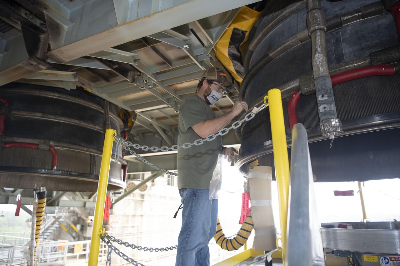Team members at NASA’s Stennis Space Center near Bay St. Louis, Mississippi, complete refurbishment work on the first core stage of the agency’s Space Launch System (SLS) rocket. The work followed a successful hot fire of the stage and its four RS-25 engines March 18. The hot fire marked the culmination of a yearlong Green Run series of tests of the stage and its integrated systems. Following refurbishment work, the core stage will be removed from the test stand and transported to Kennedy Space Center in Florida, aboard NASA’s Pegasus barge, shown delivering equipment to the B-2 Test Stand. At Kennedy, the core stage will be integrated with the rest of SLS rocket and prepared for the launch of the Artemis I mission to the Moon.  Photo Credit: NASA