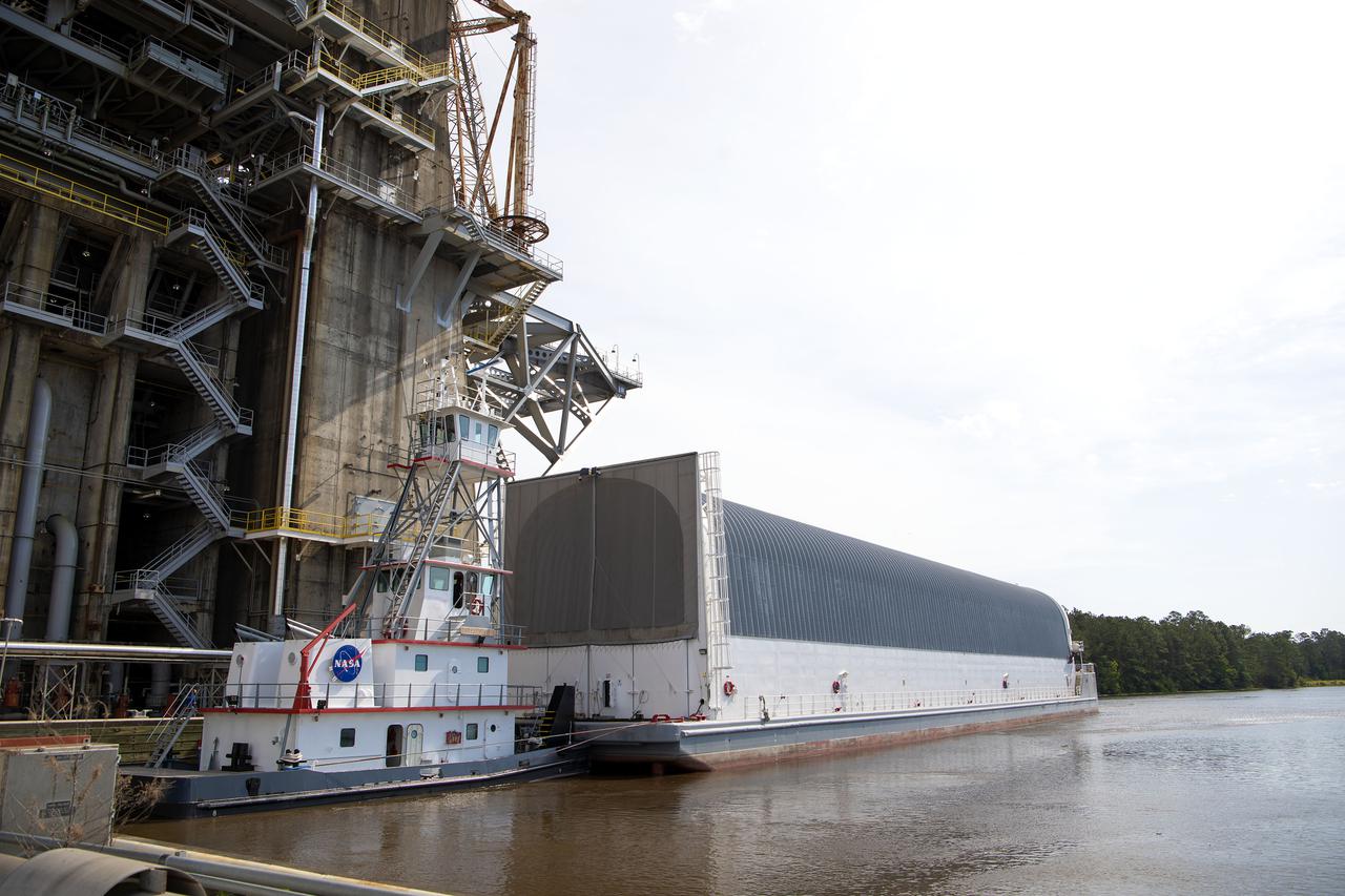 Team members at NASA’s Stennis Space Center near Bay St. Louis, Mississippi, complete refurbishment work on the first core stage of the agency’s Space Launch System (SLS) rocket. The work followed a successful hot fire of the stage and its four RS-25 engines March 18. The hot fire marked the culmination of a yearlong Green Run series of tests of the stage and its integrated systems. Following refurbishment work, the core stage will be removed from the test stand and transported to Kennedy Space Center in Florida, aboard NASA’s Pegasus barge, shown delivering equipment to the B-2 Test Stand. At Kennedy, the core stage will be integrated with the rest of SLS rocket and prepared for the launch of the Artemis I mission to the Moon.  Photo Credit: NASA