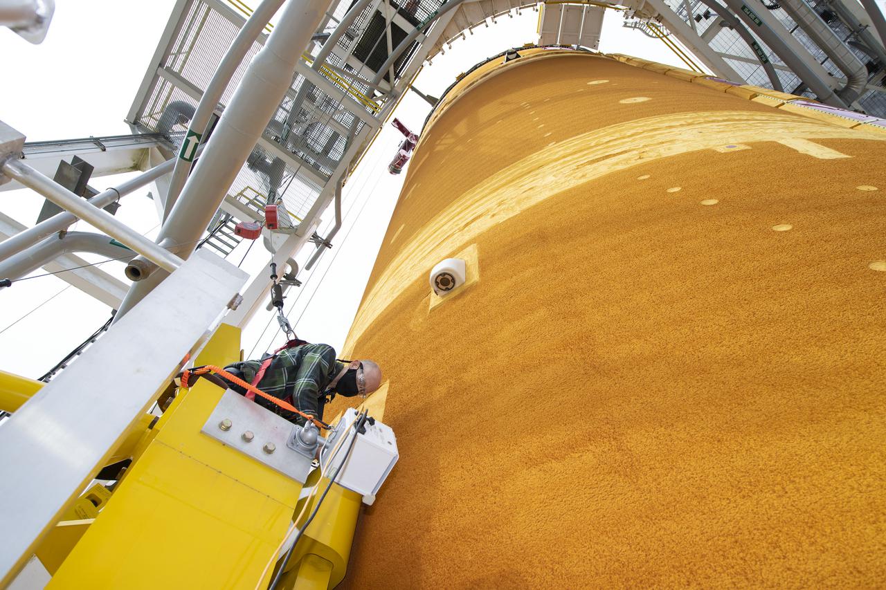 Team members at NASA’s Stennis Space Center near Bay St. Louis, Mississippi, complete refurbishment work on the first core stage of the agency’s Space Launch System (SLS) rocket. The work followed a successful hot fire of the stage and its four RS-25 engines March 18. The hot fire marked the culmination of a yearlong Green Run series of tests of the stage and its integrated systems. Following refurbishment work, the core stage will be removed from the test stand and transported to Kennedy Space Center in Florida, aboard NASA’s Pegasus barge, shown delivering equipment to the B-2 Test Stand. At Kennedy, the core stage will be integrated with the rest of SLS rocket and prepared for the launch of the Artemis I mission to the Moon.  Photo Credit: NASA