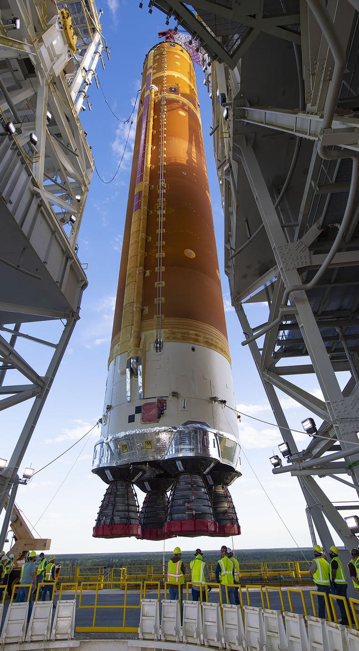 Following a successful Green Run hot fire at NASA’s Stennis Space Center near Bay St. Louis, Mississippi, on March 18, members of a blended team work April 19-20 to remove the first core stage of the agency’s Space Launch System (SLS) rocket from the B-2 Test Stand. The work required crews to lift the core stage from its vertical placement in the stand and lower it to a horizontal position on the B-2 Test Stand tarmac. The stage now will be loaded on NASA’s Pegasus barge for transport to Kennedy, where it will be prepared for launch of the Artemis I mission. Removal of the largest rocket stage ever built by NASA followed completion of a series of eight Green Run tests over the past year. During the Green Run series, teams performed a comprehensive test of the stand’s sophisticated and integrated systems. Photo Credit: NASA
