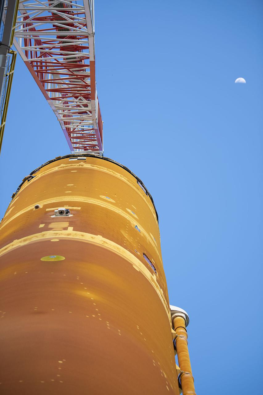 Following a successful Green Run hot fire at NASA’s Stennis Space Center near Bay St. Louis, Mississippi, on March 18, members of a blended team work April 19-20 to remove the first core stage of the agency’s Space Launch System (SLS) rocket from the B-2 Test Stand. The work required crews to lift the core stage from its vertical placement in the stand and lower it to a horizontal position on the B-2 Test Stand tarmac. The stage now will be loaded on NASA’s Pegasus barge for transport to Kennedy, where it will be prepared for launch of the Artemis I mission. Removal of the largest rocket stage ever built by NASA followed completion of a series of eight Green Run tests over the past year. During the Green Run series, teams performed a comprehensive test of the stand’s sophisticated and integrated systems. Photo Credit: NASA