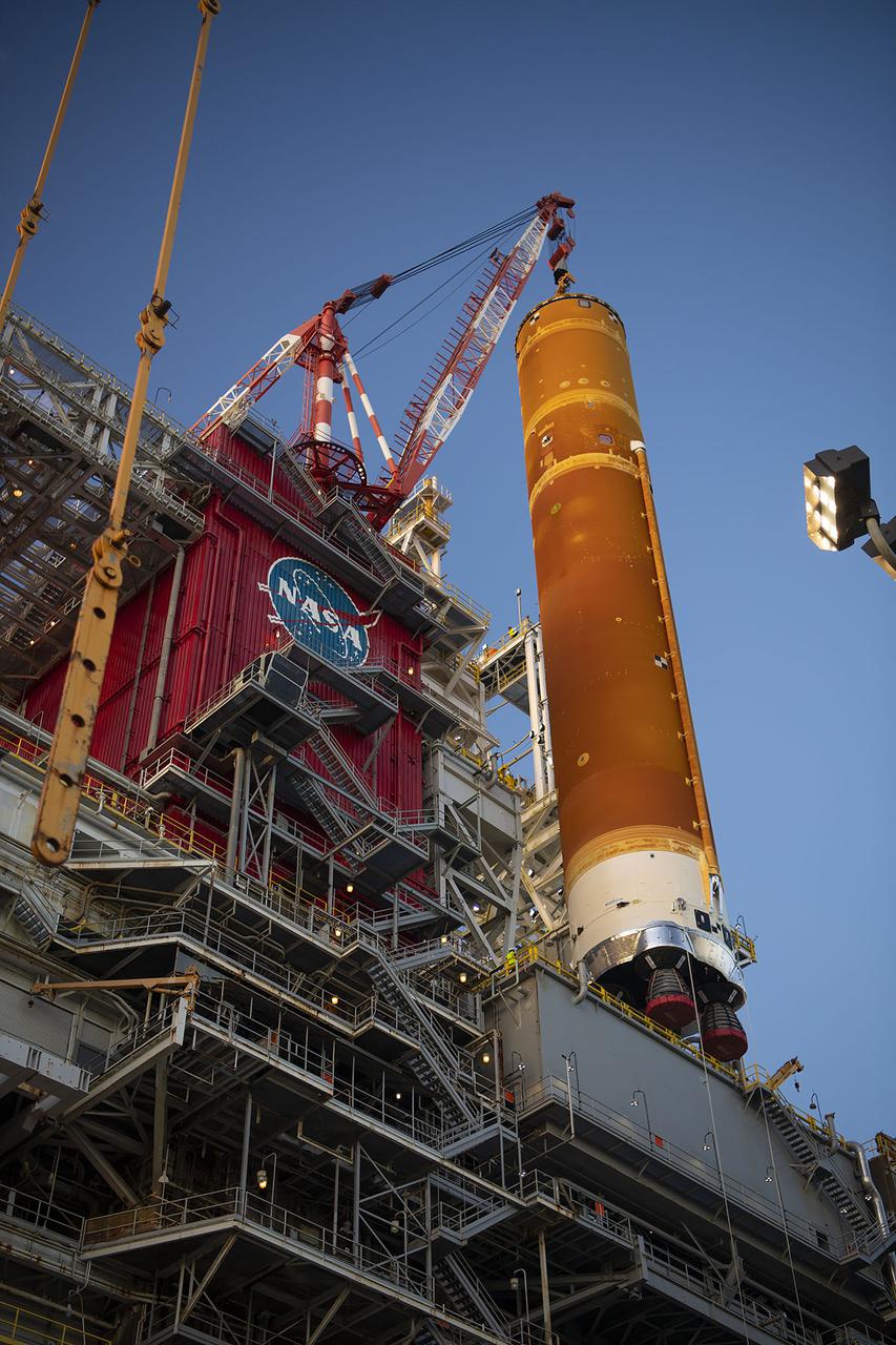 Following a successful Green Run hot fire at NASA’s Stennis Space Center near Bay St. Louis, Mississippi, on March 18, members of a blended team work April 19-20 to remove the first core stage of the agency’s Space Launch System (SLS) rocket from the B-2 Test Stand. The work required crews to lift the core stage from its vertical placement in the stand and lower it to a horizontal position on the B-2 Test Stand tarmac. The stage now will be loaded on NASA’s Pegasus barge for transport to Kennedy, where it will be prepared for launch of the Artemis I mission. Removal of the largest rocket stage ever built by NASA followed completion of a series of eight Green Run tests over the past year. During the Green Run series, teams performed a comprehensive test of the stand’s sophisticated and integrated systems. Photo Credit: NASA