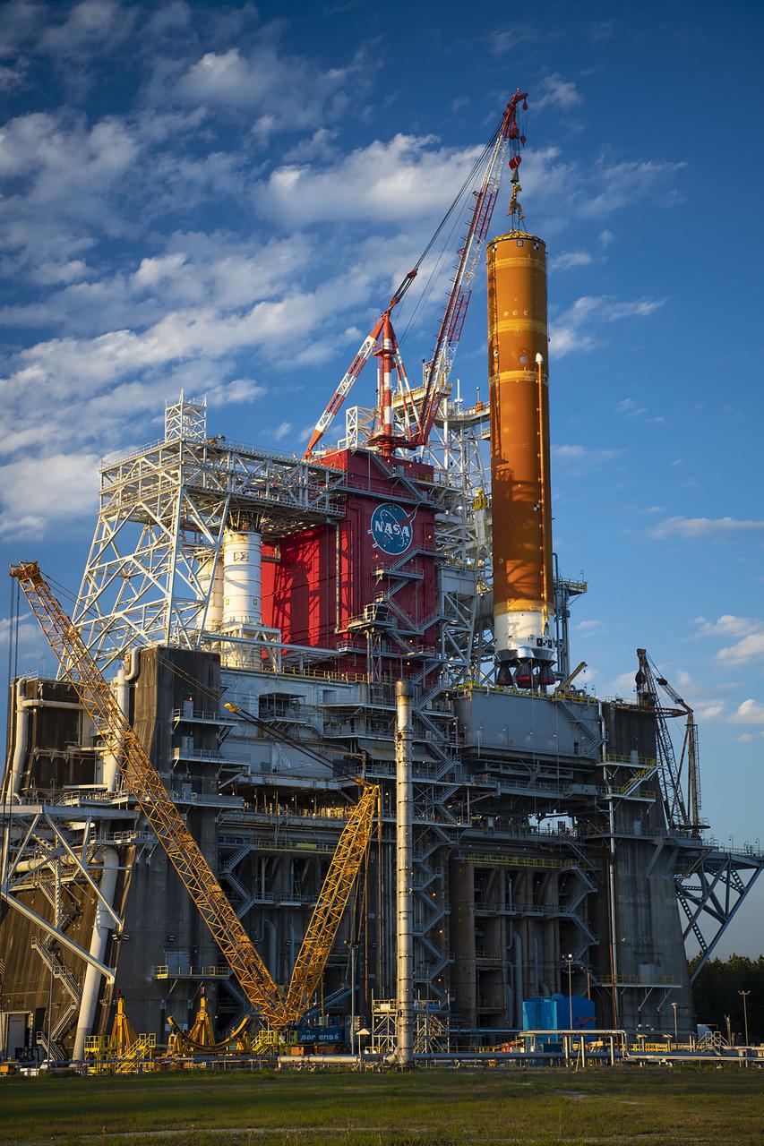 Following a successful Green Run hot fire at NASA’s Stennis Space Center near Bay St. Louis, Mississippi, on March 18, members of a blended team work April 19-20 to remove the first core stage of the agency’s Space Launch System (SLS) rocket from the B-2 Test Stand. The work required crews to lift the core stage from its vertical placement in the stand and lower it to a horizontal position on the B-2 Test Stand tarmac. The stage now will be loaded on NASA’s Pegasus barge for transport to Kennedy, where it will be prepared for launch of the Artemis I mission. Removal of the largest rocket stage ever built by NASA followed completion of a series of eight Green Run tests over the past year. During the Green Run series, teams performed a comprehensive test of the stand’s sophisticated and integrated systems. Photo Credit: NASA