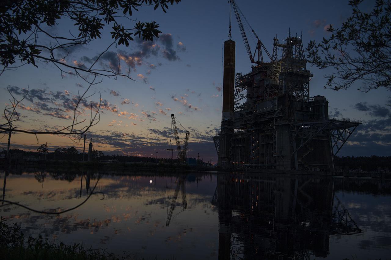 Following a successful Green Run hot fire at NASA’s Stennis Space Center near Bay St. Louis, Mississippi, on March 18, members of a blended team work April 19-20 to remove the first core stage of the agency’s Space Launch System (SLS) rocket from the B-2 Test Stand. The work required crews to lift the core stage from its vertical placement in the stand and lower it to a horizontal position on the B-2 Test Stand tarmac. The stage now will be loaded on NASA’s Pegasus barge for transport to Kennedy, where it will be prepared for launch of the Artemis I mission. Removal of the largest rocket stage ever built by NASA followed completion of a series of eight Green Run tests over the past year. During the Green Run series, teams performed a comprehensive test of the stand’s sophisticated and integrated systems. Photo Credit: NASA