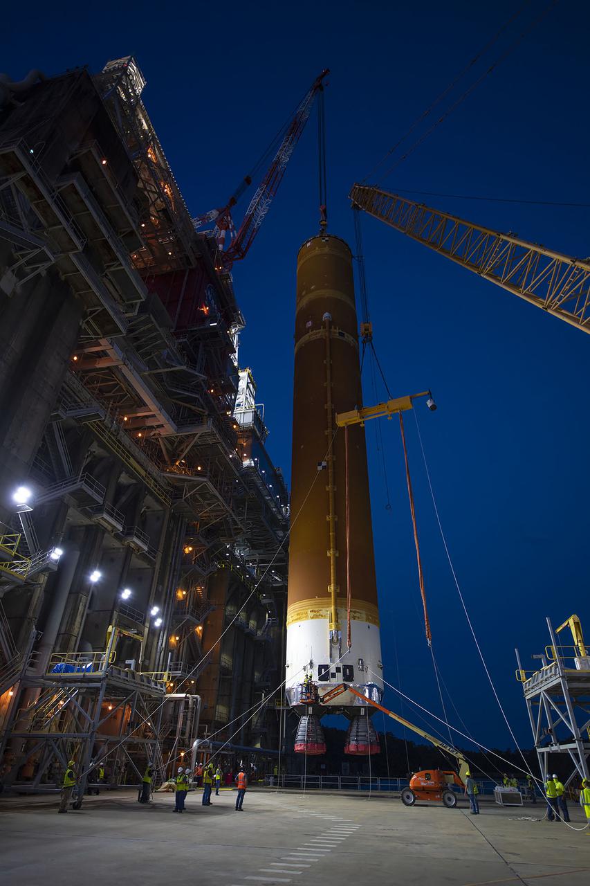 Following a successful Green Run hot fire at NASA’s Stennis Space Center near Bay St. Louis, Mississippi, on March 18, members of a blended team work April 19-20 to remove the first core stage of the agency’s Space Launch System (SLS) rocket from the B-2 Test Stand. The work required crews to lift the core stage from its vertical placement in the stand and lower it to a horizontal position on the B-2 Test Stand tarmac. The stage now will be loaded on NASA’s Pegasus barge for transport to Kennedy, where it will be prepared for launch of the Artemis I mission. Removal of the largest rocket stage ever built by NASA followed completion of a series of eight Green Run tests over the past year. During the Green Run series, teams performed a comprehensive test of the stand’s sophisticated and integrated systems. Photo Credit: NASA