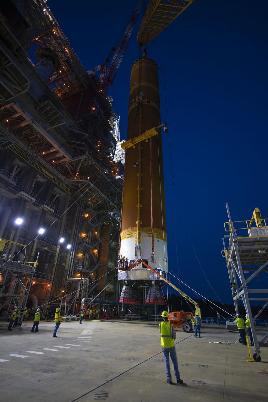 Following a successful Green Run hot fire at NASA’s Stennis Space Center near Bay St. Louis, Mississippi, on March 18, members of a blended team work April 19-20 to remove the first core stage of the agency’s Space Launch System (SLS) rocket from the B-2 Test Stand. The work required crews to lift the core stage from its vertical placement in the stand and lower it to a horizontal position on the B-2 Test Stand tarmac. The stage now will be loaded on NASA’s Pegasus barge for transport to Kennedy, where it will be prepared for launch of the Artemis I mission. Removal of the largest rocket stage ever built by NASA followed completion of a series of eight Green Run tests over the past year. During the Green Run series, teams performed a comprehensive test of the stand’s sophisticated and integrated systems. Photo Credit: NASA