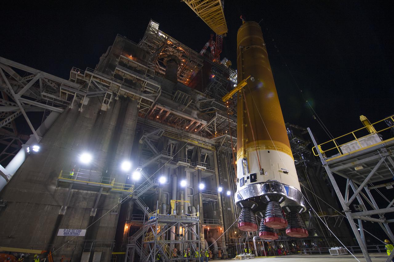 Following a successful Green Run hot fire at NASA’s Stennis Space Center near Bay St. Louis, Mississippi, on March 18, members of a blended team work April 19-20 to remove the first core stage of the agency’s Space Launch System (SLS) rocket from the B-2 Test Stand. The work required crews to lift the core stage from its vertical placement in the stand and lower it to a horizontal position on the B-2 Test Stand tarmac. The stage now will be loaded on NASA’s Pegasus barge for transport to Kennedy, where it will be prepared for launch of the Artemis I mission. Removal of the largest rocket stage ever built by NASA followed completion of a series of eight Green Run tests over the past year. During the Green Run series, teams performed a comprehensive test of the stand’s sophisticated and integrated systems. Photo Credit: NASA