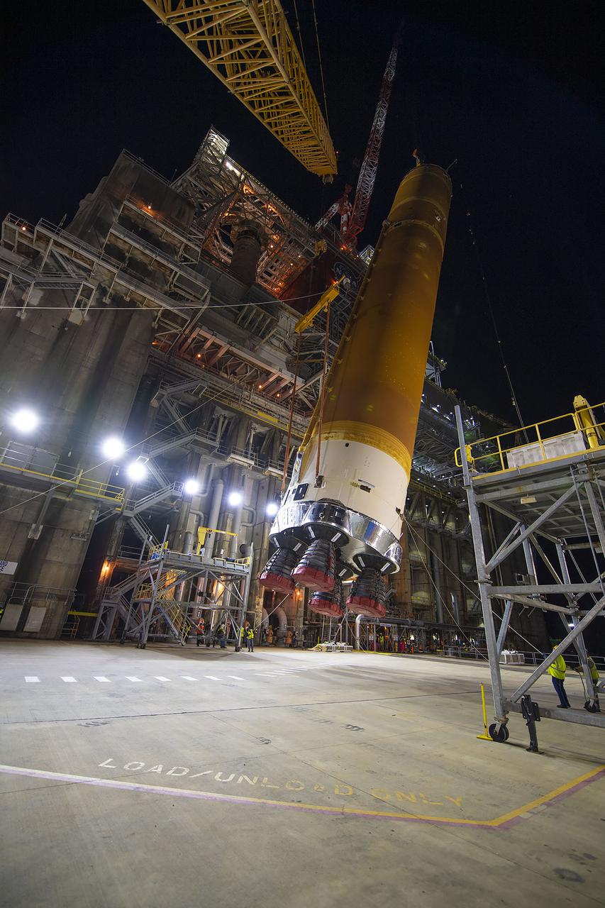 Following a successful Green Run hot fire at NASA’s Stennis Space Center near Bay St. Louis, Mississippi, on March 18, members of a blended team work April 19-20 to remove the first core stage of the agency’s Space Launch System (SLS) rocket from the B-2 Test Stand. The work required crews to lift the core stage from its vertical placement in the stand and lower it to a horizontal position on the B-2 Test Stand tarmac. The stage now will be loaded on NASA’s Pegasus barge for transport to Kennedy, where it will be prepared for launch of the Artemis I mission. Removal of the largest rocket stage ever built by NASA followed completion of a series of eight Green Run tests over the past year. During the Green Run series, teams performed a comprehensive test of the stand’s sophisticated and integrated systems. Photo Credit: NASA