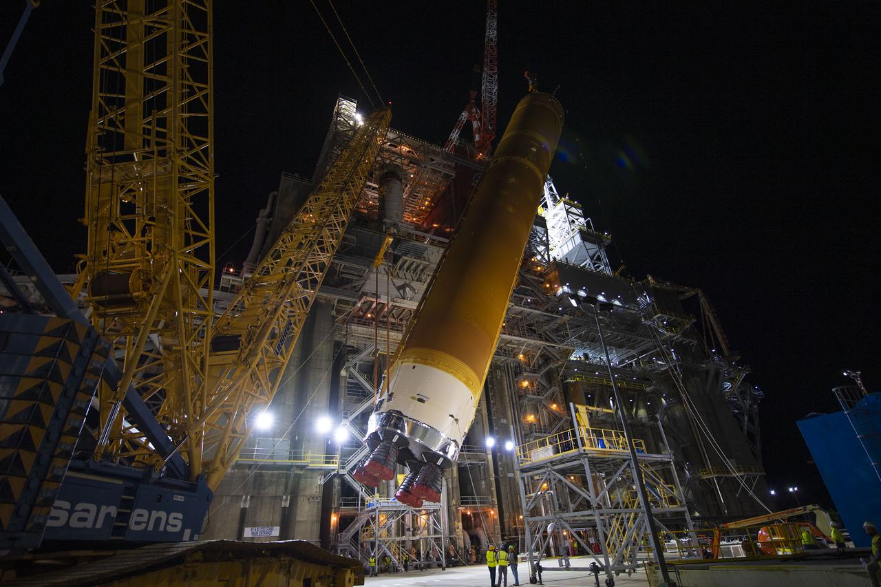 Following a successful Green Run hot fire at NASA’s Stennis Space Center near Bay St. Louis, Mississippi, on March 18, members of a blended team work April 19-20 to remove the first core stage of the agency’s Space Launch System (SLS) rocket from the B-2 Test Stand. The work required crews to lift the core stage from its vertical placement in the stand and lower it to a horizontal position on the B-2 Test Stand tarmac. The stage now will be loaded on NASA’s Pegasus barge for transport to Kennedy, where it will be prepared for launch of the Artemis I mission. Removal of the largest rocket stage ever built by NASA followed completion of a series of eight Green Run tests over the past year. During the Green Run series, teams performed a comprehensive test of the stand’s sophisticated and integrated systems. Photo Credit: NASA