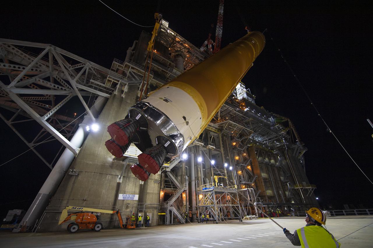 Following a successful Green Run hot fire at NASA’s Stennis Space Center near Bay St. Louis, Mississippi, on March 18, members of a blended team work April 19-20 to remove the first core stage of the agency’s Space Launch System (SLS) rocket from the B-2 Test Stand. The work required crews to lift the core stage from its vertical placement in the stand and lower it to a horizontal position on the B-2 Test Stand tarmac. The stage now will be loaded on NASA’s Pegasus barge for transport to Kennedy, where it will be prepared for launch of the Artemis I mission. Removal of the largest rocket stage ever built by NASA followed completion of a series of eight Green Run tests over the past year. During the Green Run series, teams performed a comprehensive test of the stand’s sophisticated and integrated systems. Photo Credit: NASA
