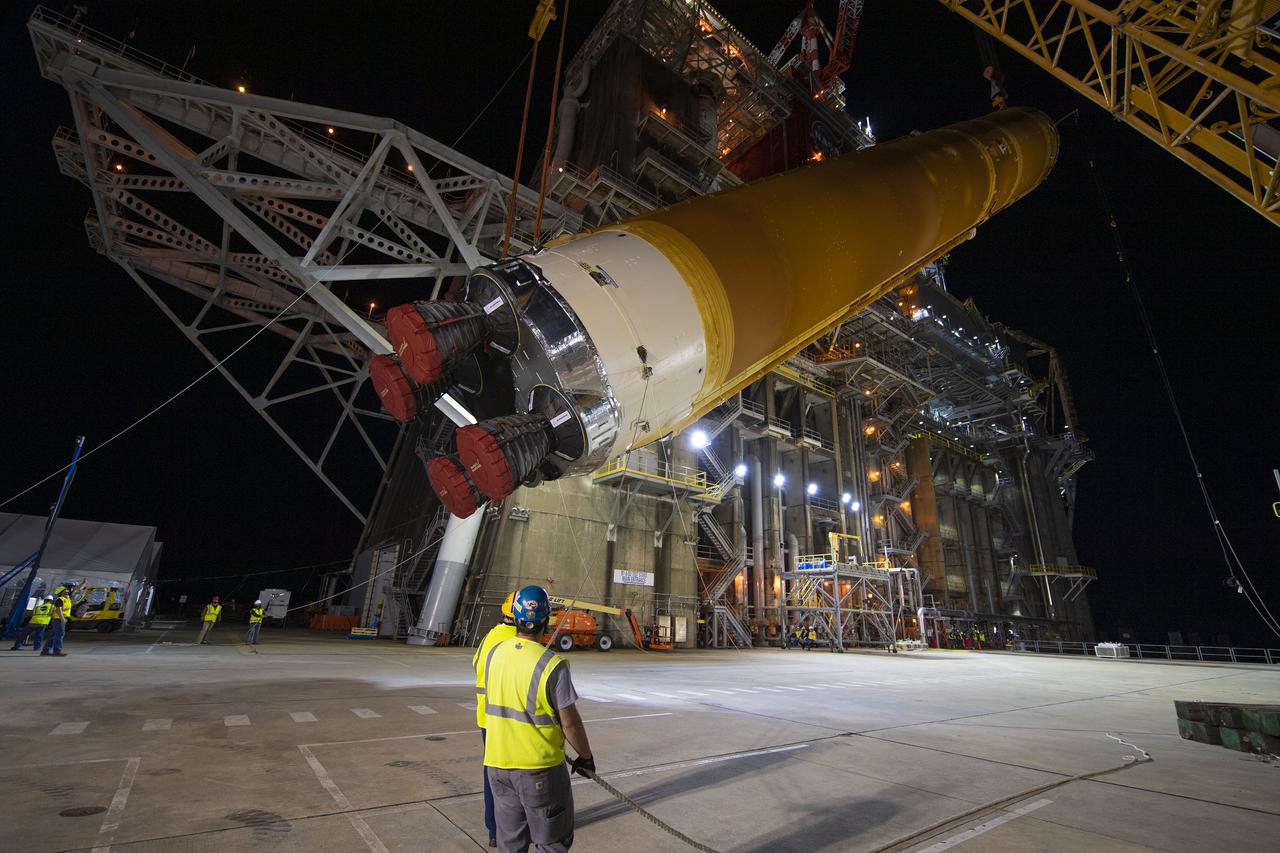 Following a successful Green Run hot fire at NASA’s Stennis Space Center near Bay St. Louis, Mississippi, on March 18, members of a blended team work April 19-20 to remove the first core stage of the agency’s Space Launch System (SLS) rocket from the B-2 Test Stand. The work required crews to lift the core stage from its vertical placement in the stand and lower it to a horizontal position on the B-2 Test Stand tarmac. The stage now will be loaded on NASA’s Pegasus barge for transport to Kennedy, where it will be prepared for launch of the Artemis I mission. Removal of the largest rocket stage ever built by NASA followed completion of a series of eight Green Run tests over the past year. During the Green Run series, teams performed a comprehensive test of the stand’s sophisticated and integrated systems. Photo Credit: NASA
