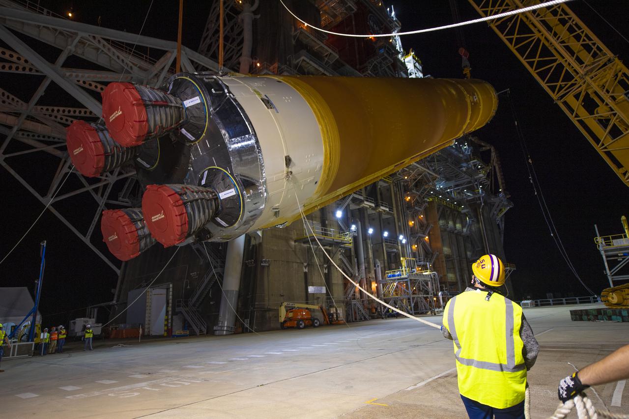 Following a successful Green Run hot fire at NASA’s Stennis Space Center near Bay St. Louis, Mississippi, on March 18, members of a blended team work April 19-20 to remove the first core stage of the agency’s Space Launch System (SLS) rocket from the B-2 Test Stand. The work required crews to lift the core stage from its vertical placement in the stand and lower it to a horizontal position on the B-2 Test Stand tarmac. The stage now will be loaded on NASA’s Pegasus barge for transport to Kennedy, where it will be prepared for launch of the Artemis I mission. Removal of the largest rocket stage ever built by NASA followed completion of a series of eight Green Run tests over the past year. During the Green Run series, teams performed a comprehensive test of the stand’s sophisticated and integrated systems. Photo Credit: NASA