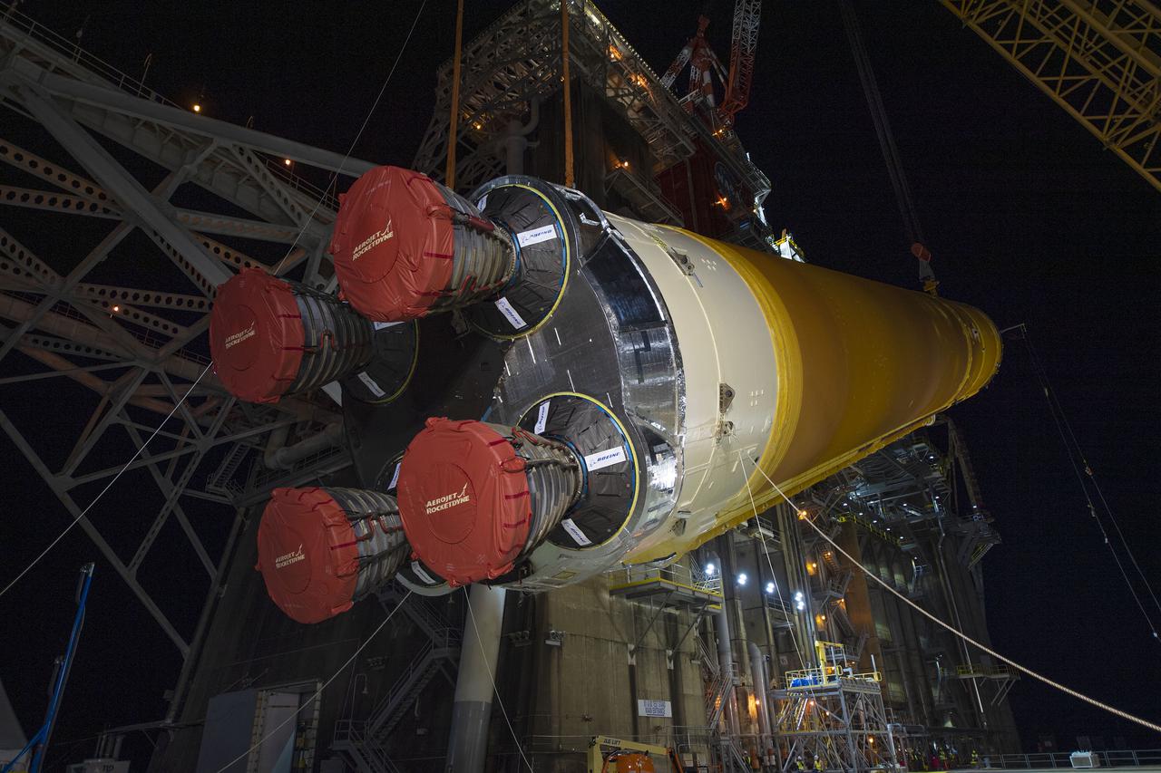 Following a successful Green Run hot fire at NASA’s Stennis Space Center near Bay St. Louis, Mississippi, on March 18, members of a blended team work April 19-20 to remove the first core stage of the agency’s Space Launch System (SLS) rocket from the B-2 Test Stand. The work required crews to lift the core stage from its vertical placement in the stand and lower it to a horizontal position on the B-2 Test Stand tarmac. The stage now will be loaded on NASA’s Pegasus barge for transport to Kennedy, where it will be prepared for launch of the Artemis I mission. Removal of the largest rocket stage ever built by NASA followed completion of a series of eight Green Run tests over the past year. During the Green Run series, teams performed a comprehensive test of the stand’s sophisticated and integrated systems. Photo Credit: NASA