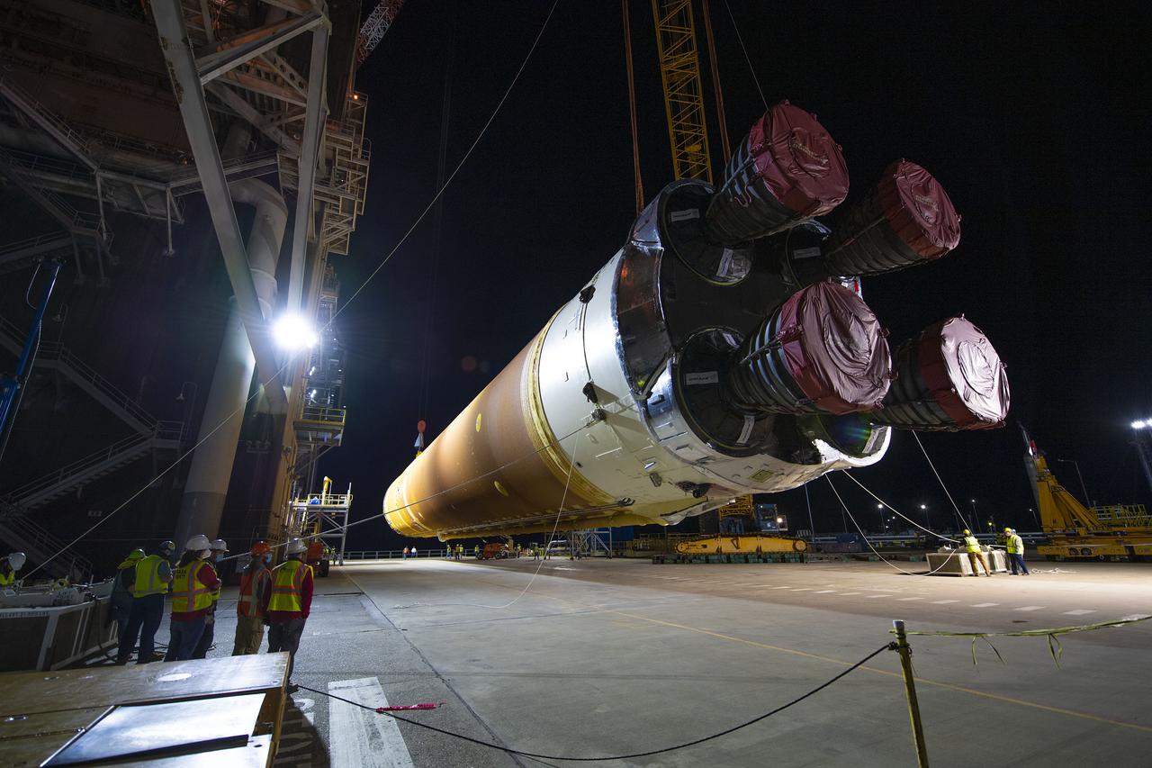 Following a successful Green Run hot fire at NASA’s Stennis Space Center near Bay St. Louis, Mississippi, on March 18, members of a blended team work April 19-20 to remove the first core stage of the agency’s Space Launch System (SLS) rocket from the B-2 Test Stand. The work required crews to lift the core stage from its vertical placement in the stand and lower it to a horizontal position on the B-2 Test Stand tarmac. The stage now will be loaded on NASA’s Pegasus barge for transport to Kennedy, where it will be prepared for launch of the Artemis I mission. Removal of the largest rocket stage ever built by NASA followed completion of a series of eight Green Run tests over the past year. During the Green Run series, teams performed a comprehensive test of the stand’s sophisticated and integrated systems. Photo Credit: NASA