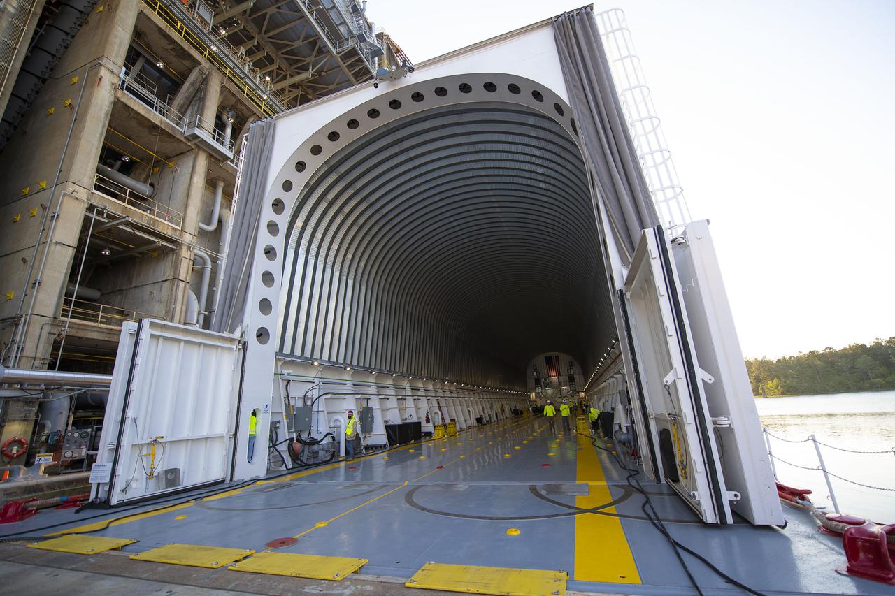 Team members at NASA’s Stennis Space Center near Bay St. Louis, Mississippi, load the first core stage of the agency’s Space Launch System (SLS) rocket on to the agency’s Pegasus barge in preparation for its transport to Kennedy Space Center in Florida. The loading activity followed removal of the stage from the B-2 Test Stand at Stennis on April 19-20, 2021. It comes about a month after NASA conducted a successful hot fire of the stage and its four RS-25 engines on March 18 and after teams completed various refurbishment activities. Once at Kennedy, the will be integrated with the rest of SLS rocket and prepared for the launch of the Artemis I mission to the Moon. Photo Credit: NASA
