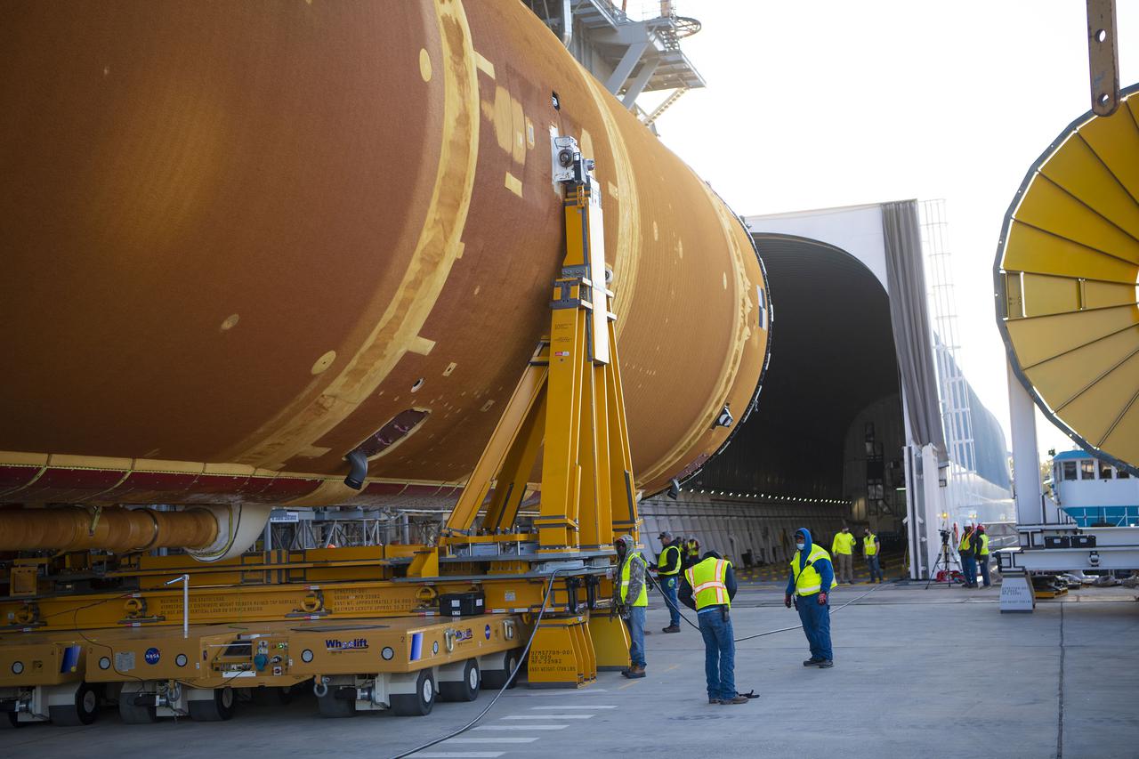 Team members at NASA’s Stennis Space Center near Bay St. Louis, Mississippi, load the first core stage of the agency’s Space Launch System (SLS) rocket on to the agency’s Pegasus barge in preparation for its transport to Kennedy Space Center in Florida. The loading activity followed removal of the stage from the B-2 Test Stand at Stennis on April 19-20, 2021. It comes about a month after NASA conducted a successful hot fire of the stage and its four RS-25 engines on March 18 and after teams completed various refurbishment activities. Once at Kennedy, the will be integrated with the rest of SLS rocket and prepared for the launch of the Artemis I mission to the Moon. Photo Credit: NASA