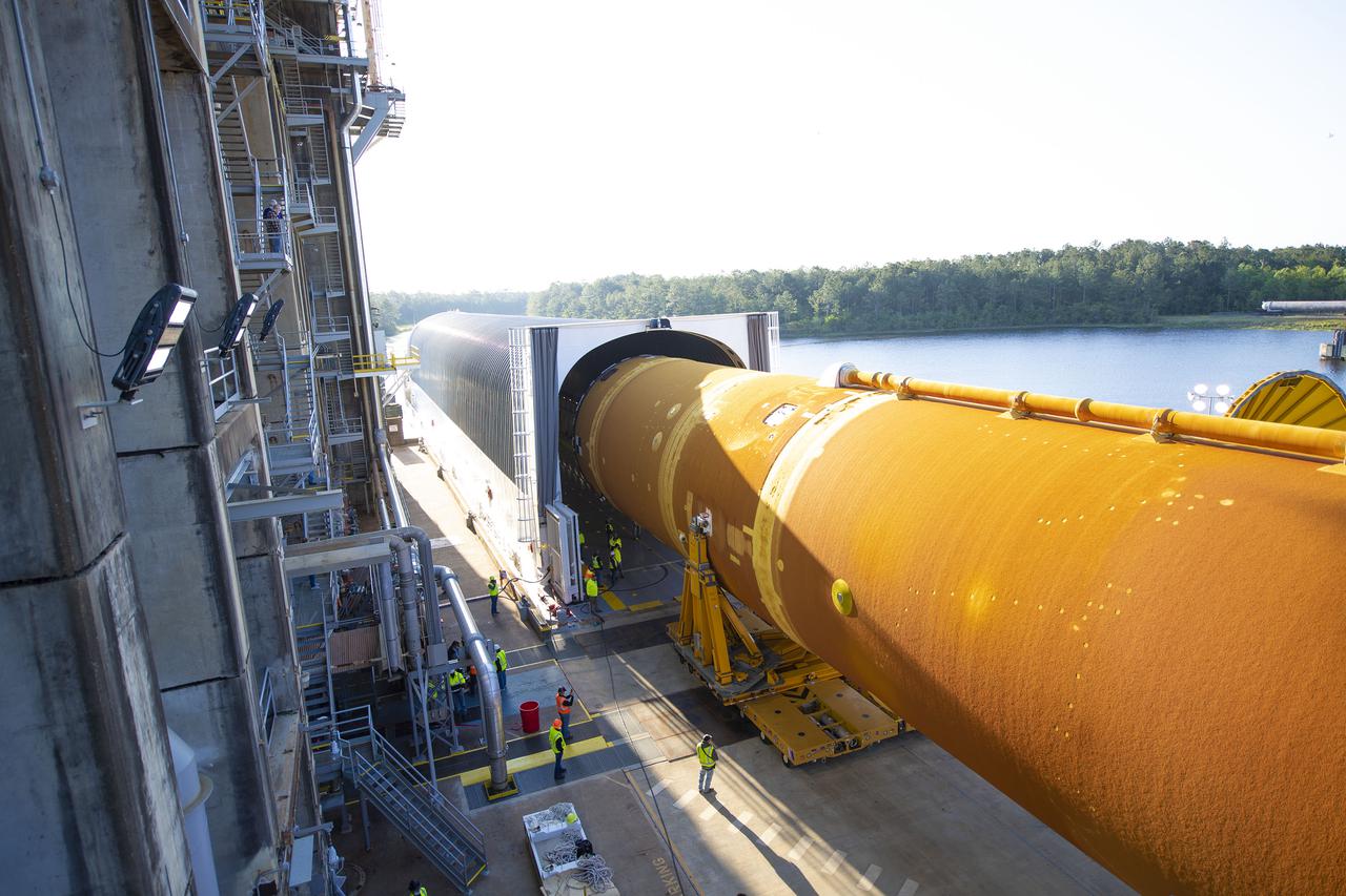 Team members at NASA’s Stennis Space Center near Bay St. Louis, Mississippi, load the first core stage of the agency’s Space Launch System (SLS) rocket on to the agency’s Pegasus barge in preparation for its transport to Kennedy Space Center in Florida. The loading activity followed removal of the stage from the B-2 Test Stand at Stennis on April 19-20, 2021. It comes about a month after NASA conducted a successful hot fire of the stage and its four RS-25 engines on March 18 and after teams completed various refurbishment activities. Once at Kennedy, the will be integrated with the rest of SLS rocket and prepared for the launch of the Artemis I mission to the Moon. Photo Credit: NASA
