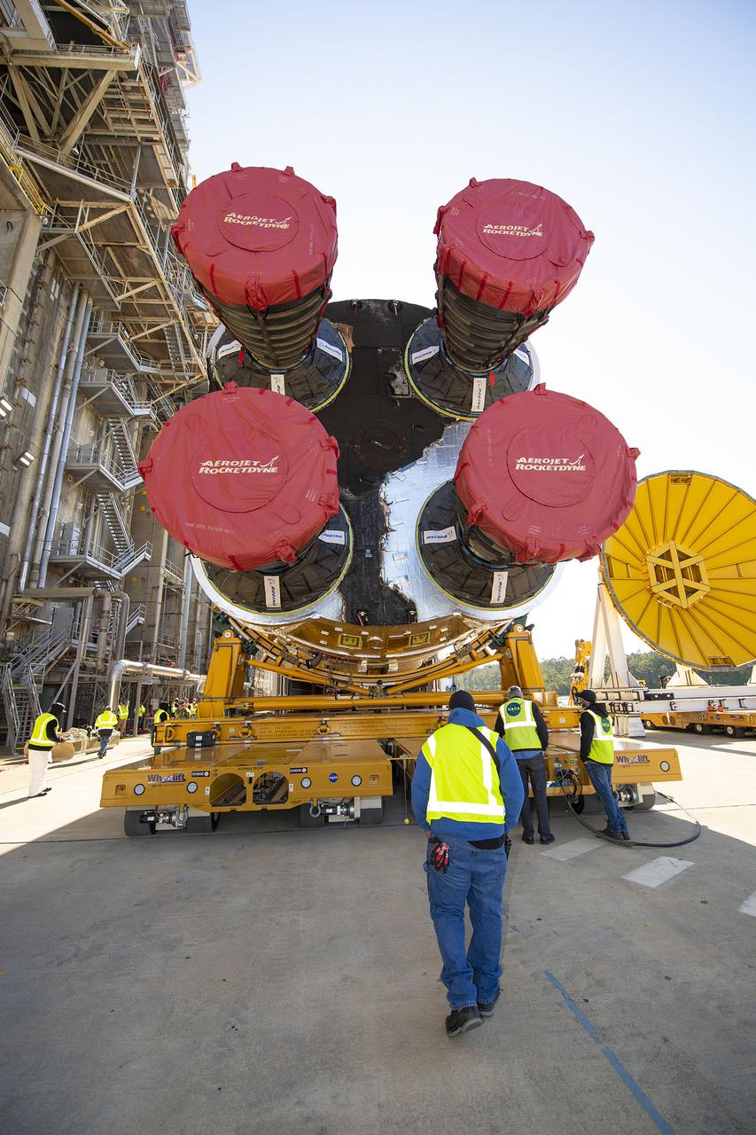 Team members at NASA’s Stennis Space Center near Bay St. Louis, Mississippi, load the first core stage of the agency’s Space Launch System (SLS) rocket on to the agency’s Pegasus barge in preparation for its transport to Kennedy Space Center in Florida. The loading activity followed removal of the stage from the B-2 Test Stand at Stennis on April 19-20, 2021. It comes about a month after NASA conducted a successful hot fire of the stage and its four RS-25 engines on March 18 and after teams completed various refurbishment activities. Once at Kennedy, the will be integrated with the rest of SLS rocket and prepared for the launch of the Artemis I mission to the Moon. Photo Credit: NASA