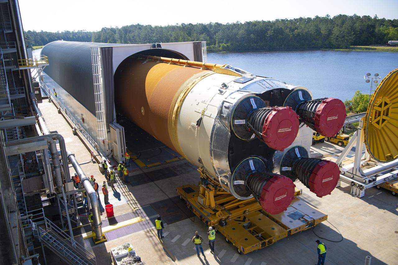 Team members at NASA’s Stennis Space Center near Bay St. Louis, Mississippi, load the first core stage of the agency’s Space Launch System (SLS) rocket on to the agency’s Pegasus barge in preparation for its transport to Kennedy Space Center in Florida. The loading activity followed removal of the stage from the B-2 Test Stand at Stennis on April 19-20, 2021. It comes about a month after NASA conducted a successful hot fire of the stage and its four RS-25 engines on March 18 and after teams completed various refurbishment activities. Once at Kennedy, the will be integrated with the rest of SLS rocket and prepared for the launch of the Artemis I mission to the Moon. Photo Credit: NASA