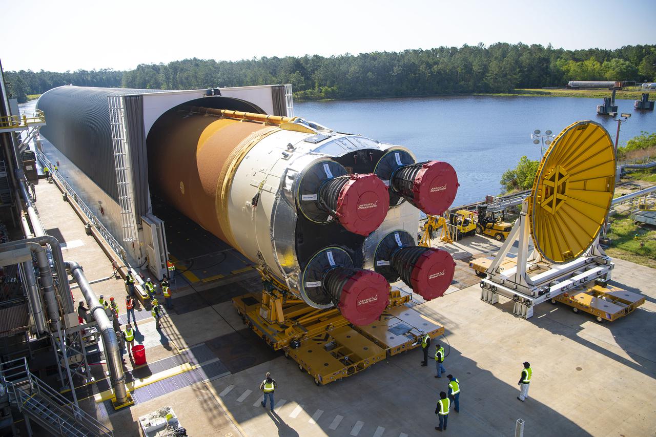 Team members at NASA’s Stennis Space Center near Bay St. Louis, Mississippi, load the first core stage of the agency’s Space Launch System (SLS) rocket on to the agency’s Pegasus barge in preparation for its transport to Kennedy Space Center in Florida. The loading activity followed removal of the stage from the B-2 Test Stand at Stennis on April 19-20, 2021. It comes about a month after NASA conducted a successful hot fire of the stage and its four RS-25 engines on March 18 and after teams completed various refurbishment activities. Once at Kennedy, the will be integrated with the rest of SLS rocket and prepared for the launch of the Artemis I mission to the Moon. Photo Credit: NASA