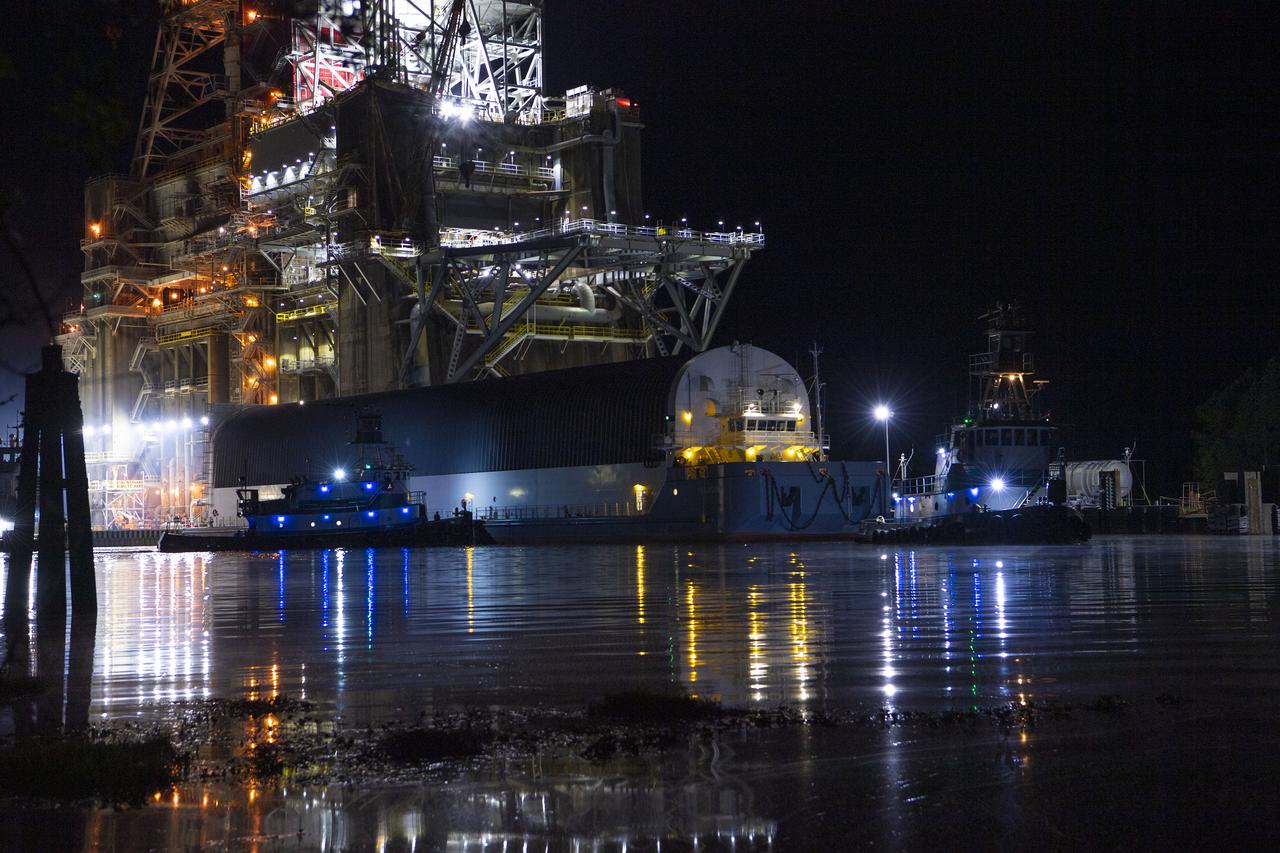 The first core stage of NASA’s Space Launch System (SLS) rocket, loaded onto the agency’s Pegasus barge, departs Stennis Space Center near Bay St. Louis, Mississippi, headed to Kennedy Space Center in Florida. The departure of the core stage in mid-April 2021 followed completion of a Green Run test series of the stage systems in preparation for its launch on the Artemis I mission. The Green Run series concluded with a March 18 hot fire of the stage’s four RS-25 engines on the B-2 Test Stand at Stennis, just as during an actual launch. Following refurbishment work, the stage was removed from the B-2 stand and loaded onto the Pegasus barge for transport. Once at Kennedy, the will be integrated with the rest of SLS rocket and prepared for the launch of the Artemis I mission to the Moon. Photo Credit: NASA