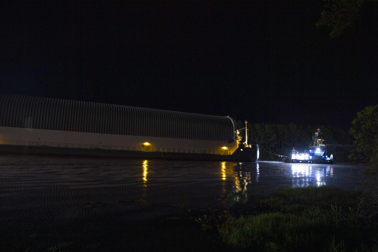 The first core stage of NASA’s Space Launch System (SLS) rocket, loaded onto the agency’s Pegasus barge, departs Stennis Space Center near Bay St. Louis, Mississippi, headed to Kennedy Space Center in Florida. The departure of the core stage in mid-April 2021 followed completion of a Green Run test series of the stage systems in preparation for its launch on the Artemis I mission. The Green Run series concluded with a March 18 hot fire of the stage’s four RS-25 engines on the B-2 Test Stand at Stennis, just as during an actual launch. Following refurbishment work, the stage was removed from the B-2 stand and loaded onto the Pegasus barge for transport. Once at Kennedy, the will be integrated with the rest of SLS rocket and prepared for the launch of the Artemis I mission to the Moon. Photo Credit: NASA
