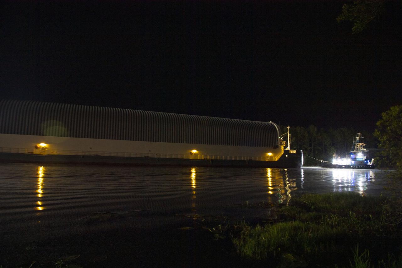 The first core stage of NASA’s Space Launch System (SLS) rocket, loaded onto the agency’s Pegasus barge, departs Stennis Space Center near Bay St. Louis, Mississippi, headed to Kennedy Space Center in Florida. The departure of the core stage in mid-April 2021 followed completion of a Green Run test series of the stage systems in preparation for its launch on the Artemis I mission. The Green Run series concluded with a March 18 hot fire of the stage’s four RS-25 engines on the B-2 Test Stand at Stennis, just as during an actual launch. Following refurbishment work, the stage was removed from the B-2 stand and loaded onto the Pegasus barge for transport. Once at Kennedy, the will be integrated with the rest of SLS rocket and prepared for the launch of the Artemis I mission to the Moon. Photo Credit: NASA