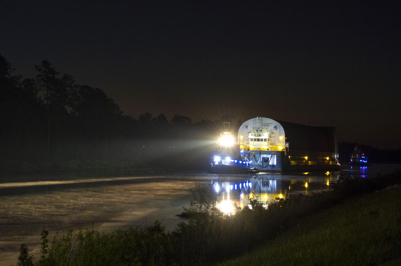 The first core stage of NASA’s Space Launch System (SLS) rocket, loaded onto the agency’s Pegasus barge, departs Stennis Space Center near Bay St. Louis, Mississippi, headed to Kennedy Space Center in Florida. The departure of the core stage in mid-April 2021 followed completion of a Green Run test series of the stage systems in preparation for its launch on the Artemis I mission. The Green Run series concluded with a March 18 hot fire of the stage’s four RS-25 engines on the B-2 Test Stand at Stennis, just as during an actual launch. Following refurbishment work, the stage was removed from the B-2 stand and loaded onto the Pegasus barge for transport. Once at Kennedy, the will be integrated with the rest of SLS rocket and prepared for the launch of the Artemis I mission to the Moon. Photo Credit: NASA