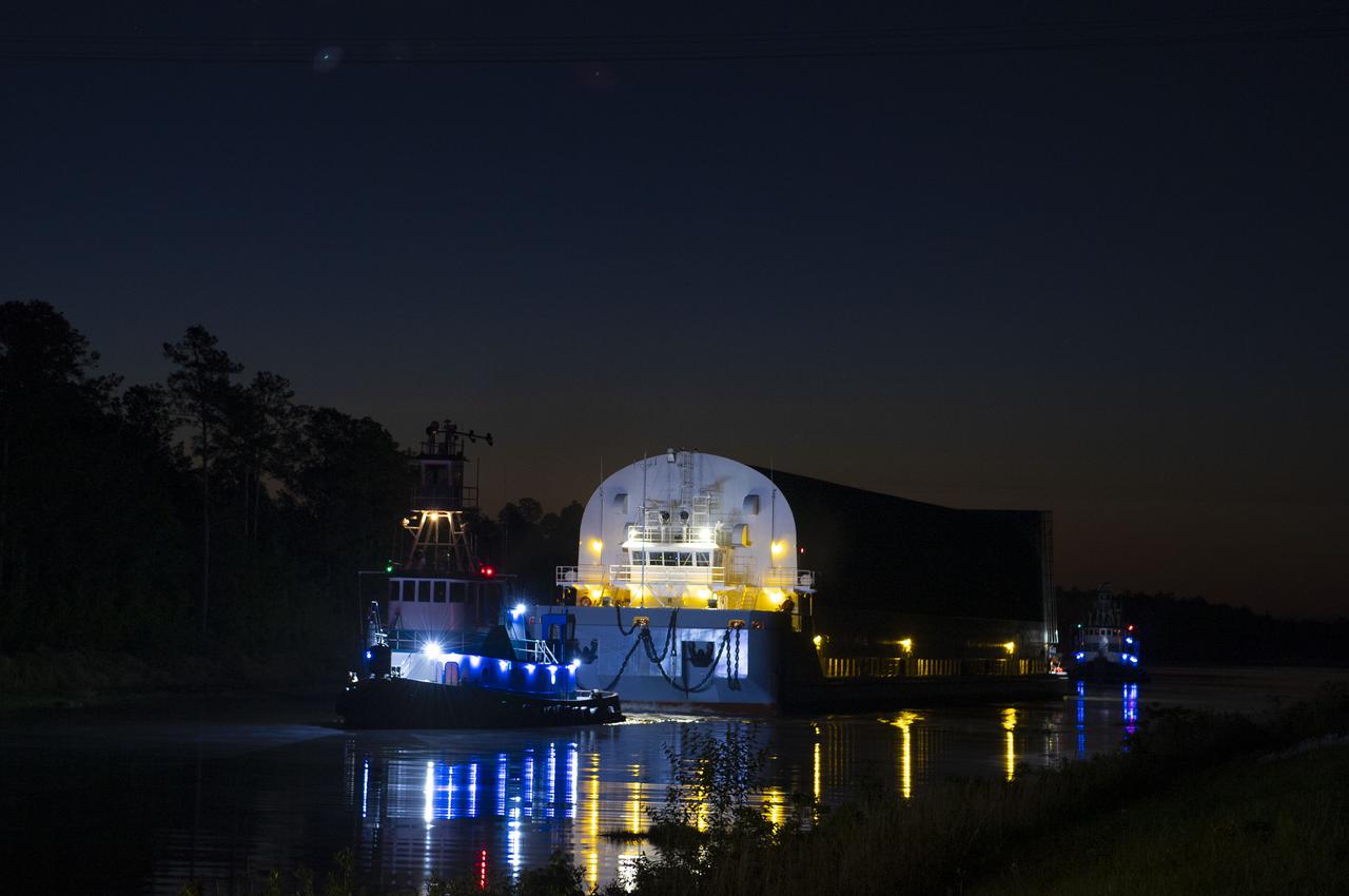 The first core stage of NASA’s Space Launch System (SLS) rocket, loaded onto the agency’s Pegasus barge, departs Stennis Space Center near Bay St. Louis, Mississippi, headed to Kennedy Space Center in Florida. The departure of the core stage in mid-April 2021 followed completion of a Green Run test series of the stage systems in preparation for its launch on the Artemis I mission. The Green Run series concluded with a March 18 hot fire of the stage’s four RS-25 engines on the B-2 Test Stand at Stennis, just as during an actual launch. Following refurbishment work, the stage was removed from the B-2 stand and loaded onto the Pegasus barge for transport. Once at Kennedy, the will be integrated with the rest of SLS rocket and prepared for the launch of the Artemis I mission to the Moon. Photo Credit: NASA