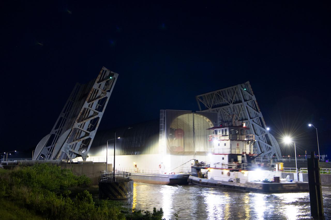 The first core stage of NASA’s Space Launch System (SLS) rocket, loaded onto the agency’s Pegasus barge, departs Stennis Space Center near Bay St. Louis, Mississippi, headed to Kennedy Space Center in Florida. The departure of the core stage in mid-April 2021 followed completion of a Green Run test series of the stage systems in preparation for its launch on the Artemis I mission. The Green Run series concluded with a March 18 hot fire of the stage’s four RS-25 engines on the B-2 Test Stand at Stennis, just as during an actual launch. Following refurbishment work, the stage was removed from the B-2 stand and loaded onto the Pegasus barge for transport. Once at Kennedy, the will be integrated with the rest of SLS rocket and prepared for the launch of the Artemis I mission to the Moon. Photo Credit: NASA