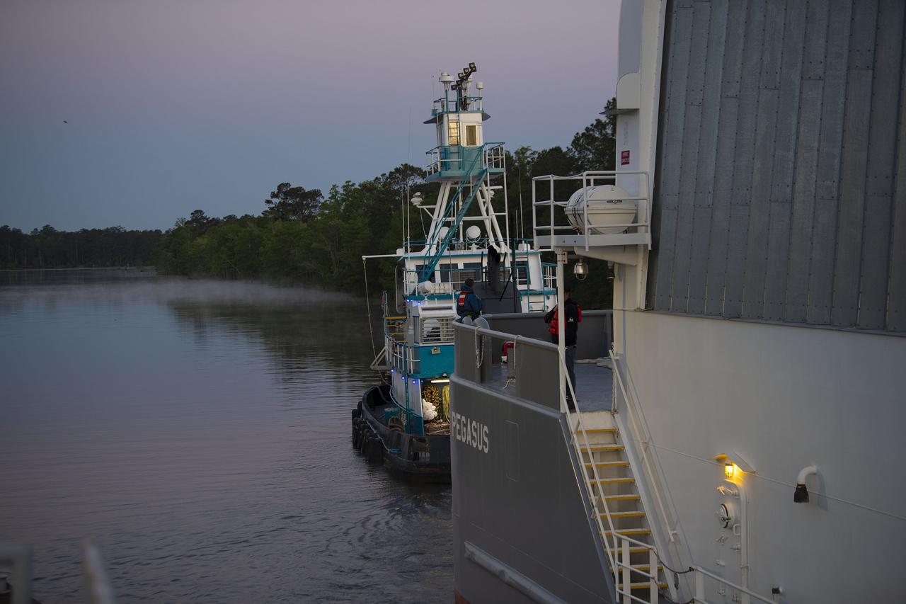 The first core stage of NASA’s Space Launch System (SLS) rocket, loaded onto the agency’s Pegasus barge, departs Stennis Space Center near Bay St. Louis, Mississippi, headed to Kennedy Space Center in Florida. The departure of the core stage in mid-April 2021 followed completion of a Green Run test series of the stage systems in preparation for its launch on the Artemis I mission. The Green Run series concluded with a March 18 hot fire of the stage’s four RS-25 engines on the B-2 Test Stand at Stennis, just as during an actual launch. Following refurbishment work, the stage was removed from the B-2 stand and loaded onto the Pegasus barge for transport. Once at Kennedy, the will be integrated with the rest of SLS rocket and prepared for the launch of the Artemis I mission to the Moon. Photo Credit: NASA